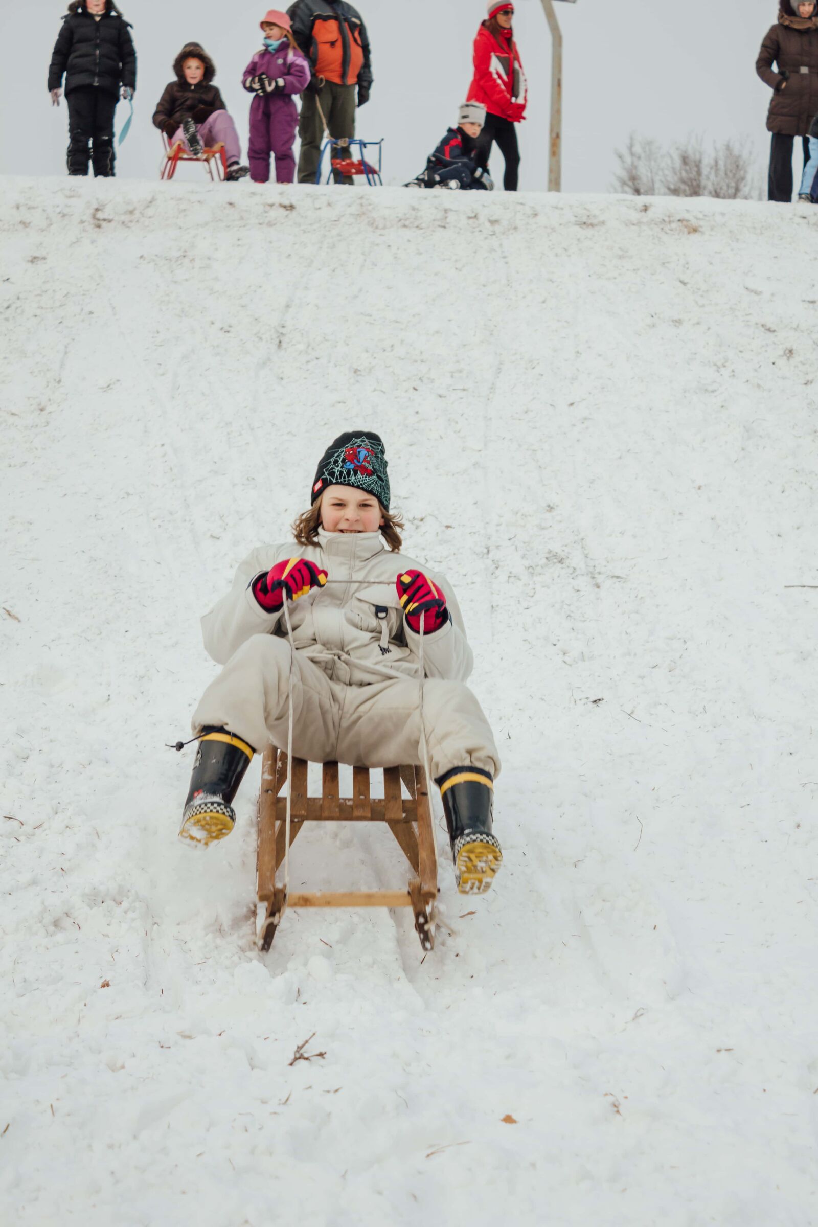 Canon EF-S 18-55mm F3.5-5.6 IS sample photo. Sled, fun, winter, kids photography