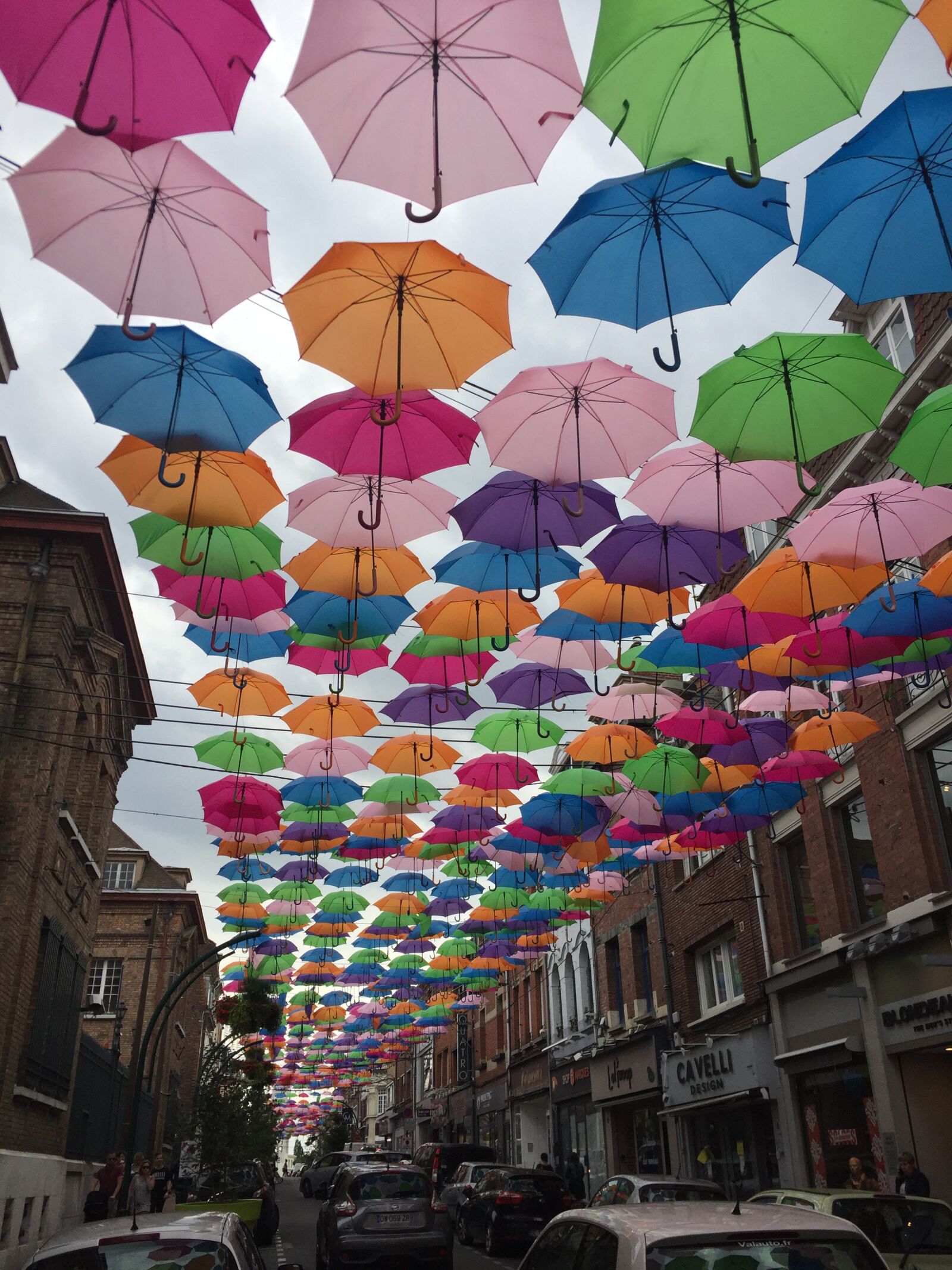 iPhone 6 back camera 4.15mm f/2.2 sample photo. Umbrellas, street, city photography