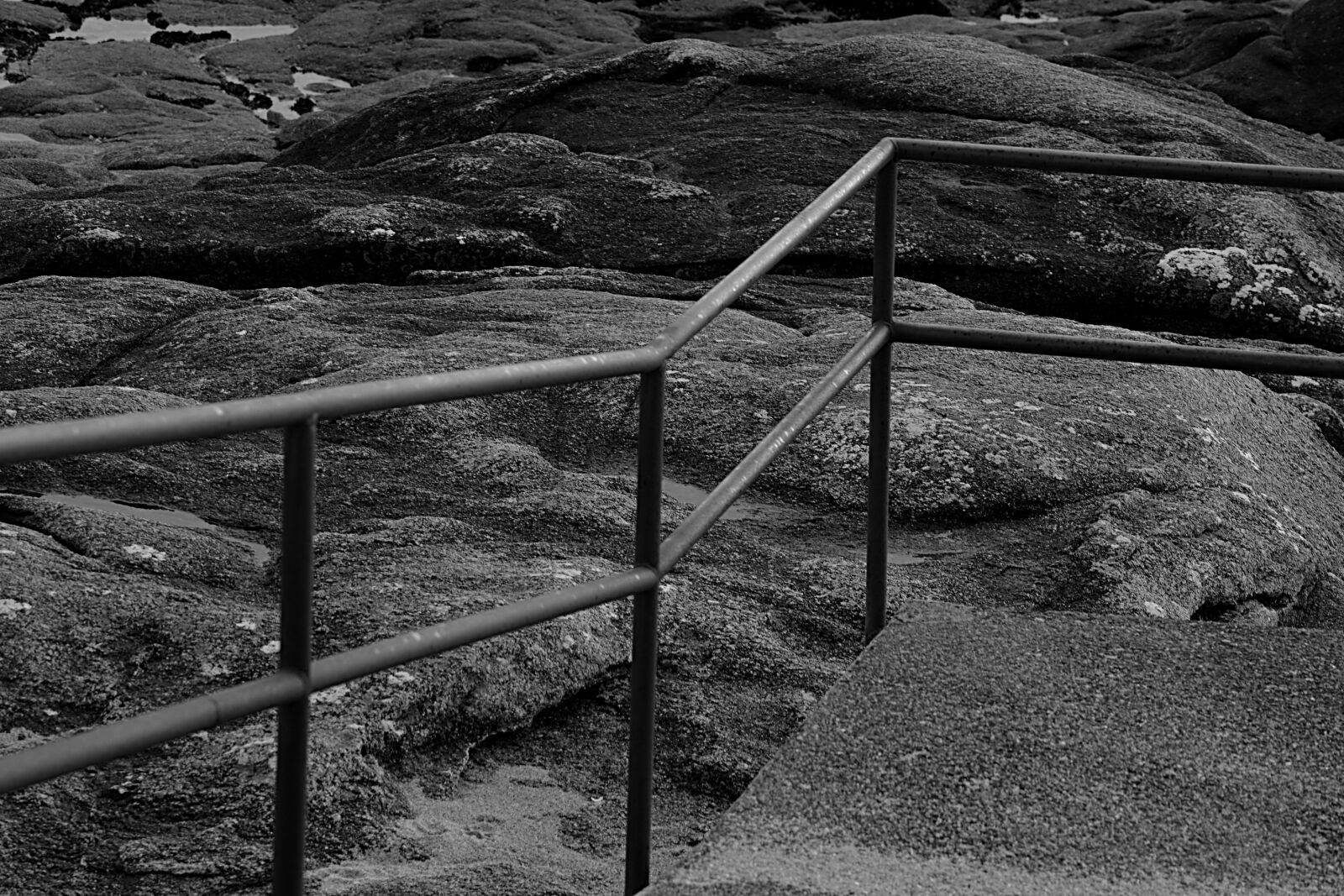 Nikon D5200 sample photo. Barrier, metal, rocks photography
