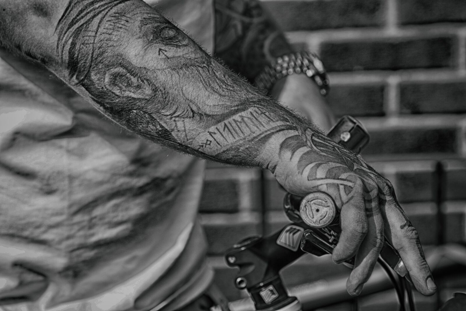 Canon EOS 7D Mark II + Canon EF 135mm F2L USM sample photo. Arm, hand, bike photography