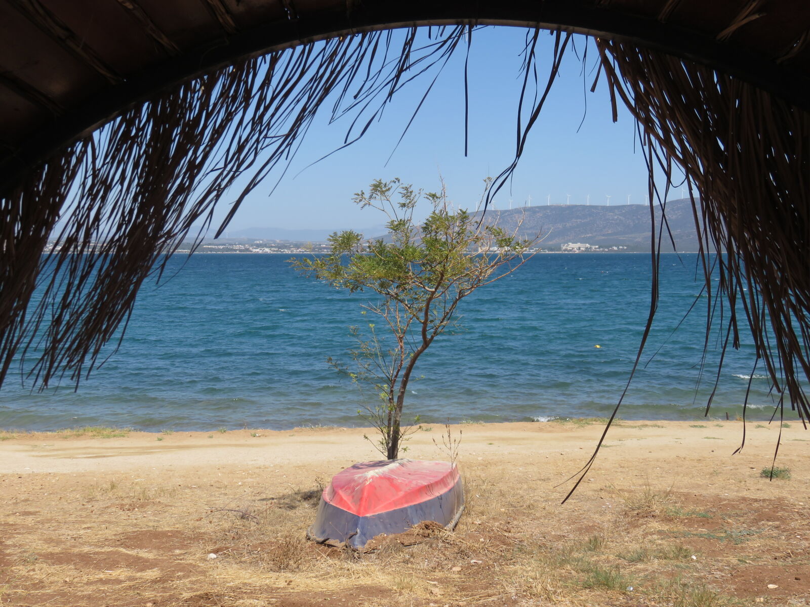 Canon PowerShot SX700 HS sample photo. A loner boat under photography