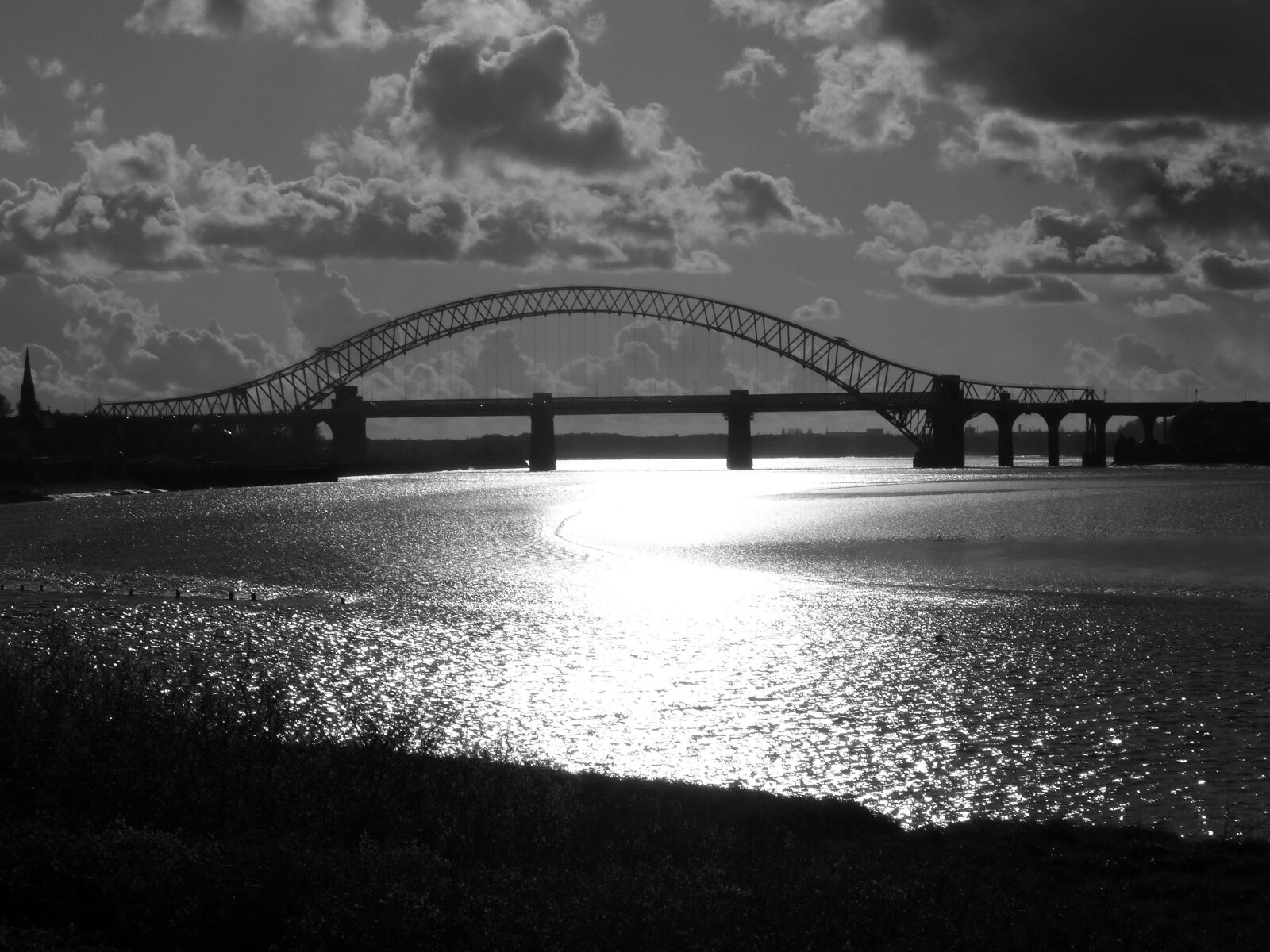 Panasonic Lumix DMC-FZ200 sample photo. Sunset, water, bridge photography