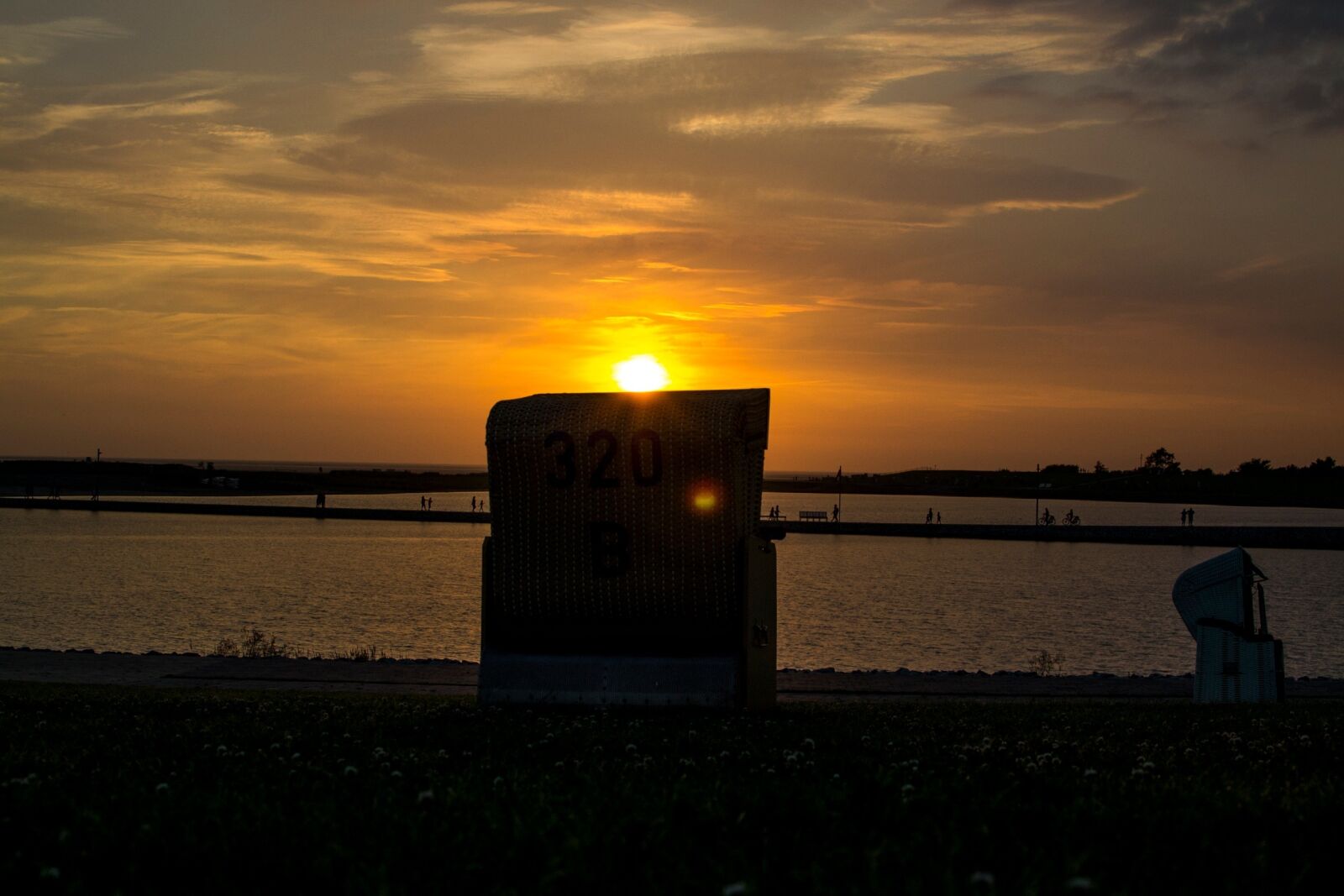 Nikon D3100 sample photo. Sunset, beach chair, north photography