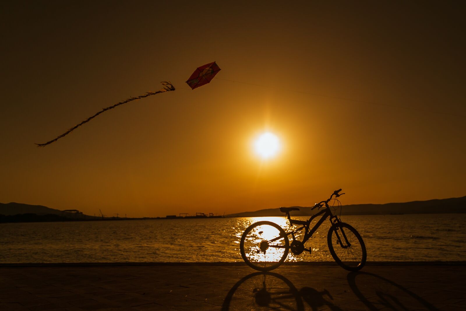 Canon EOS 6D + Canon EF 24-105mm F4L IS USM sample photo. Sunset, bicycle, kite photography