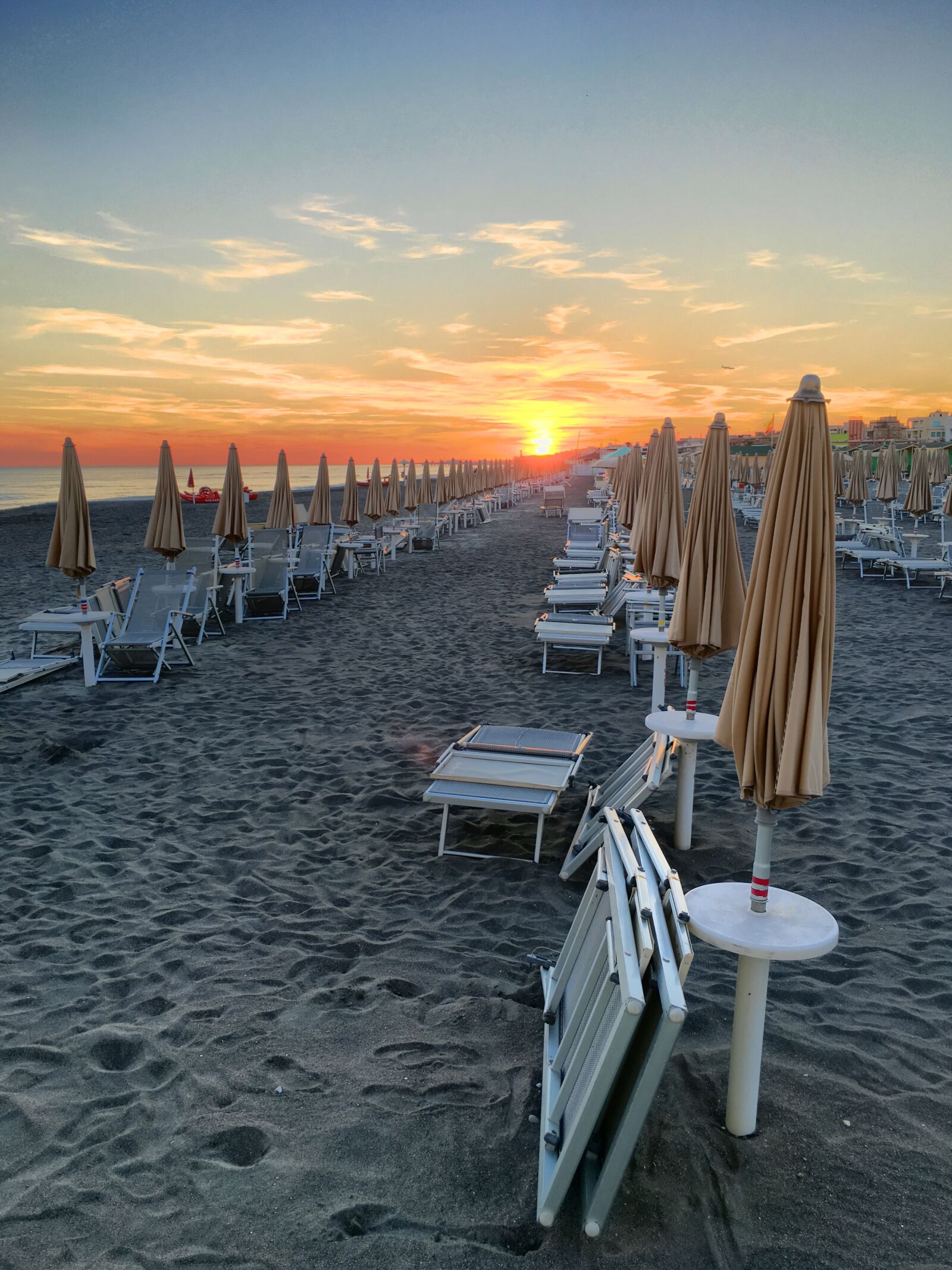 Apple iPhone 6s Plus sample photo. Beach, umbrellas, sunset photography