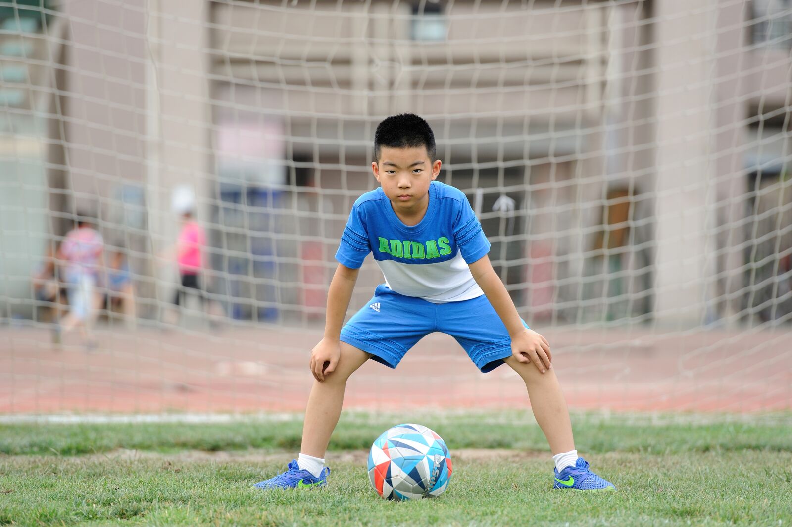 Nikon D700 sample photo. Football, teenager, greenery photography