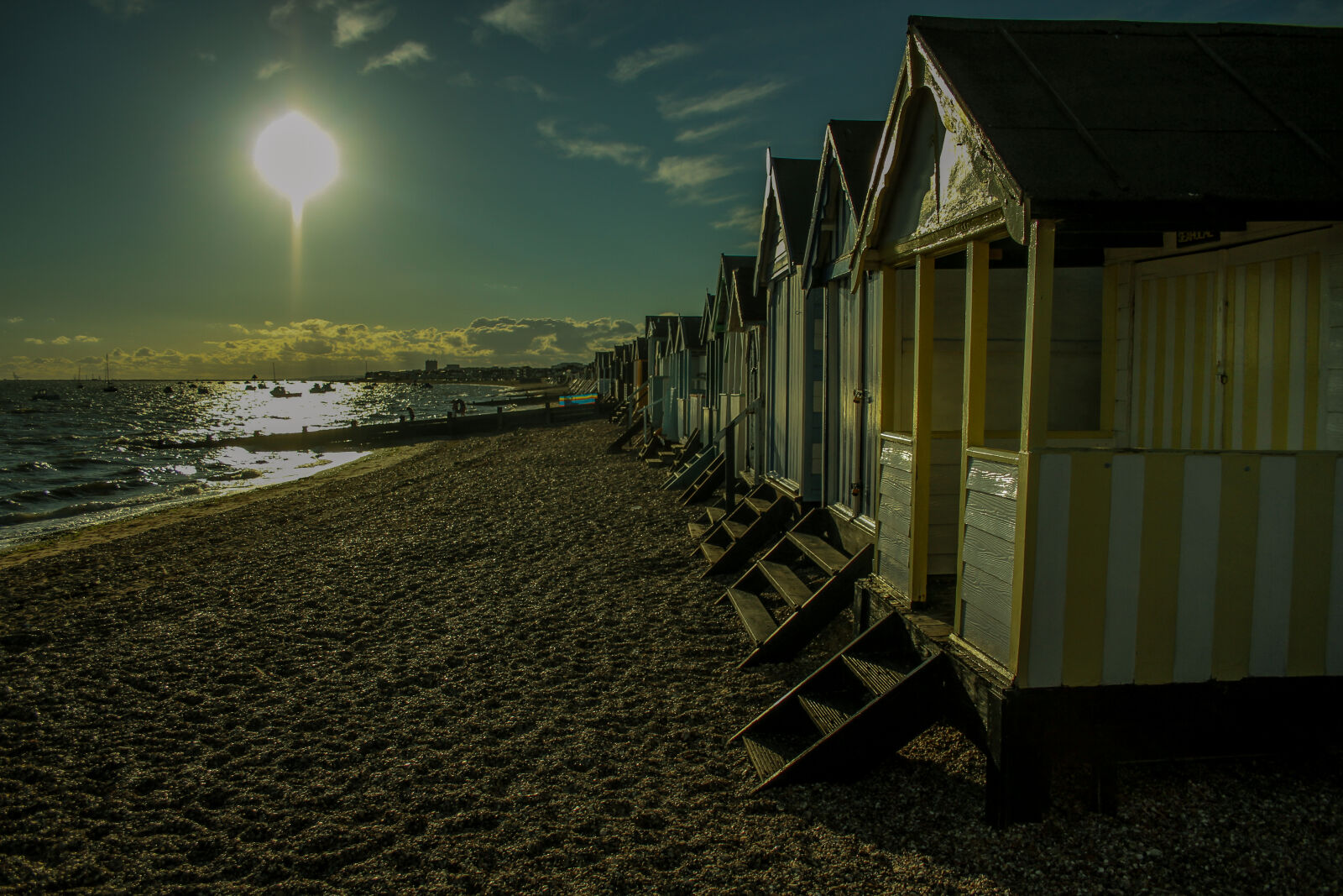 Canon EOS 7D + Canon EF-S 18-55mm F3.5-5.6 II sample photo. Beach, beachhuts, clouds, sand photography