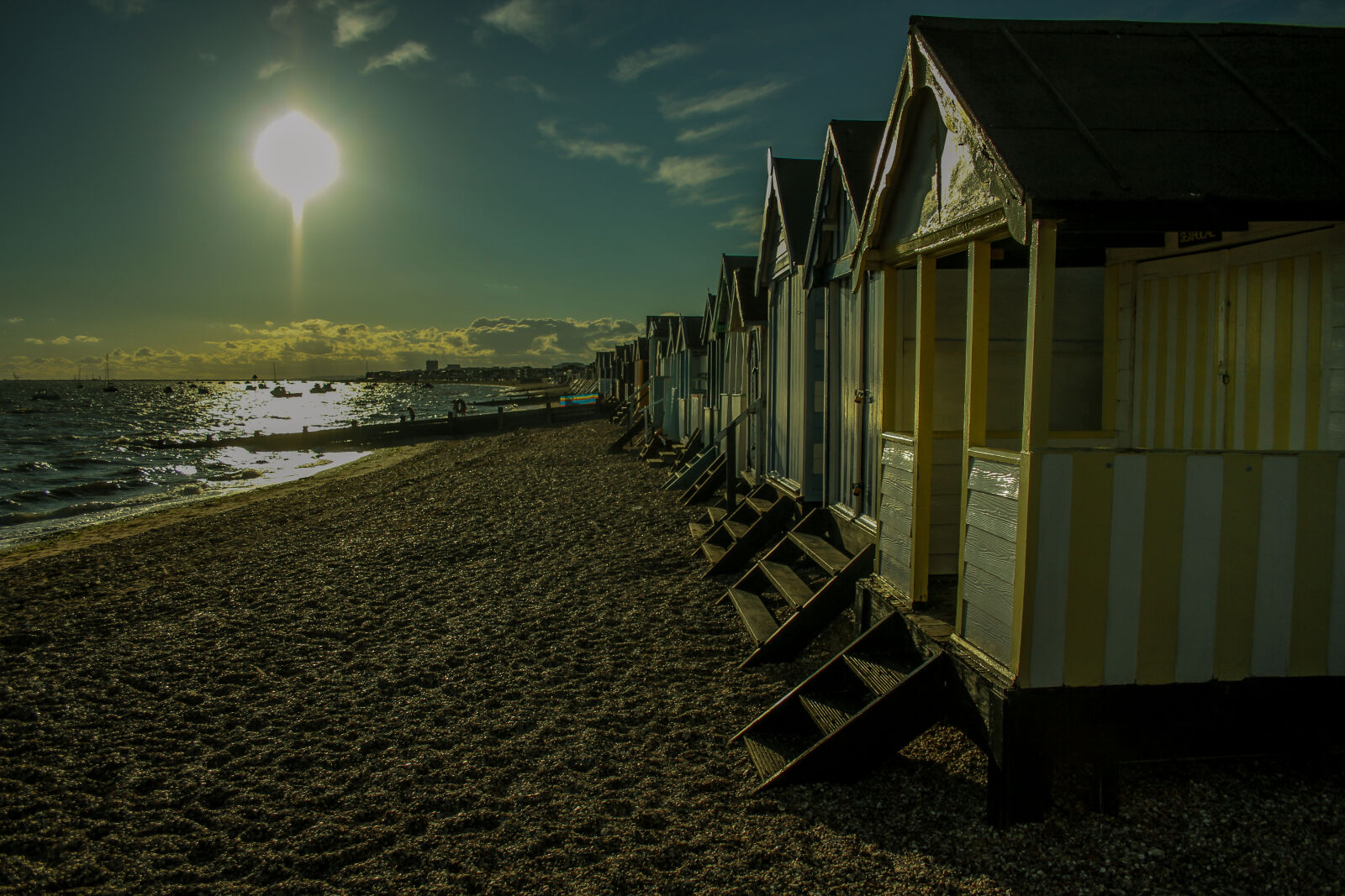 Canon EF-S 18-55mm F3.5-5.6 II sample photo. Beach, beachhuts, clouds, sand photography