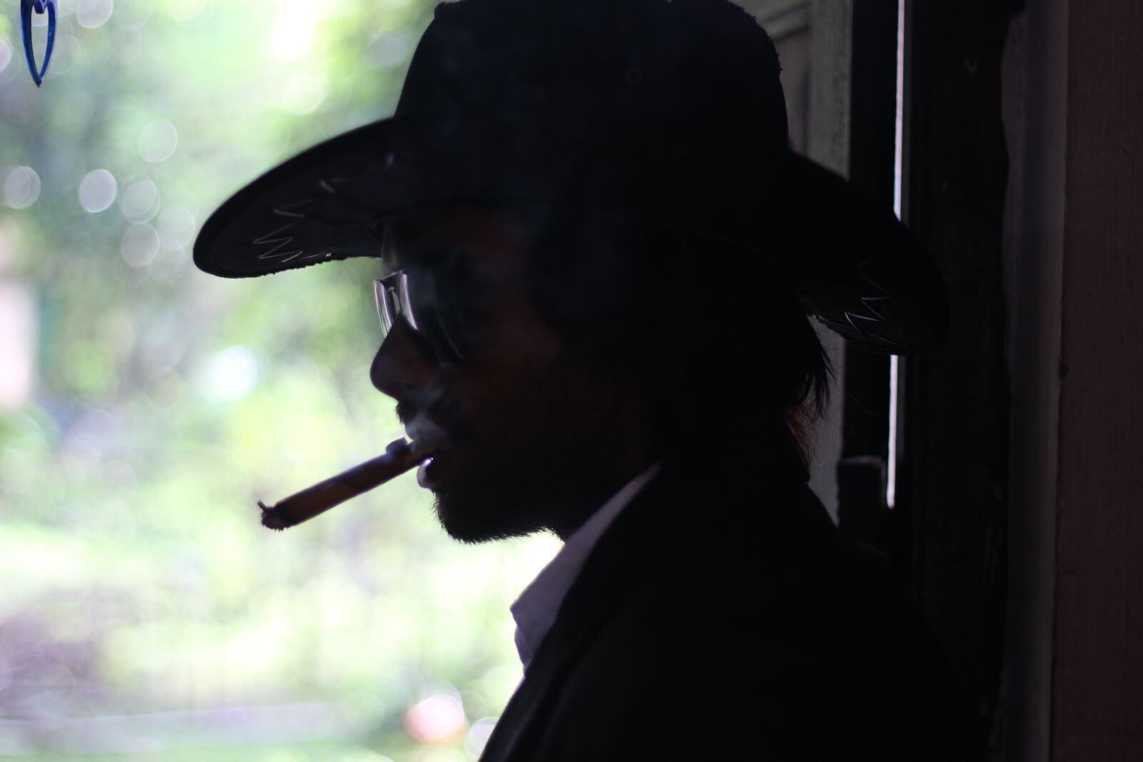 Canon EOS 700D (EOS Rebel T5i / EOS Kiss X7i) + Canon EF 50mm F1.8 STM sample photo. Cowboy hat, smoking, bangladeshi photography