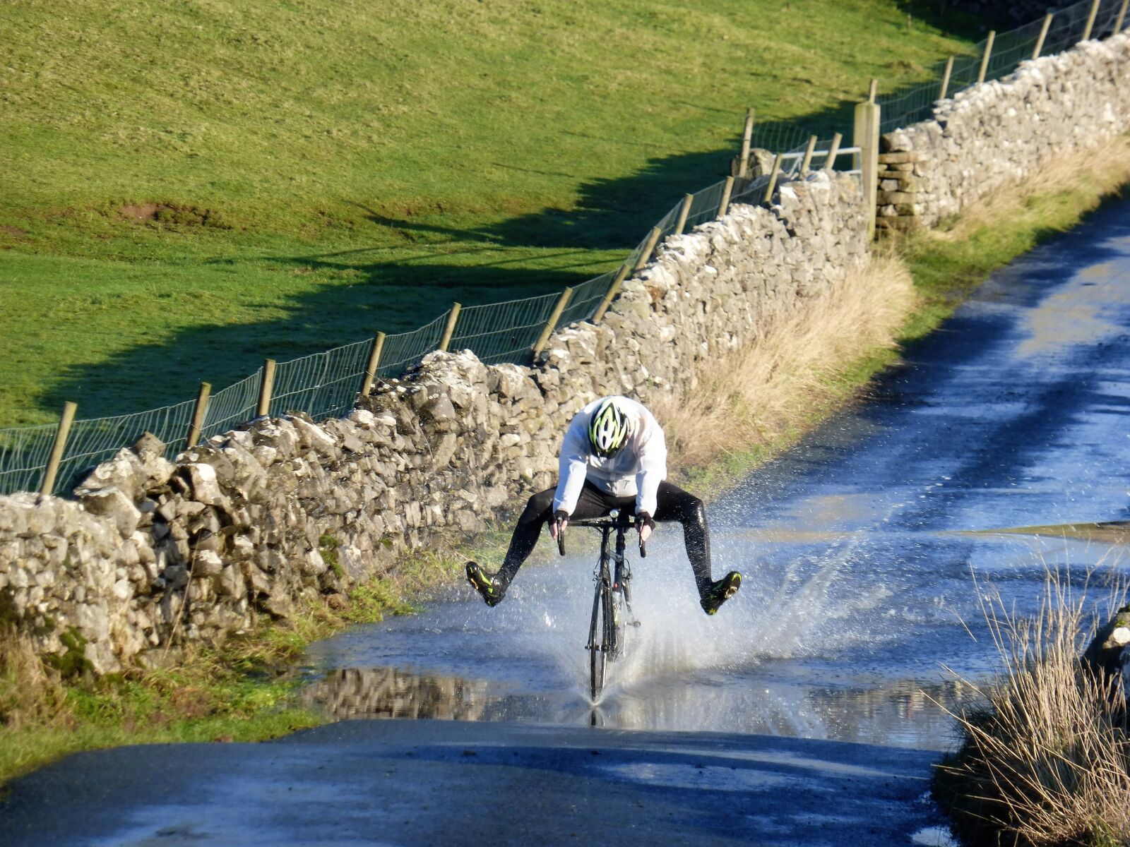 Panasonic Lumix DMC-ZS25 (Lumix DMC-TZ35) sample photo. Water splash, motion, bicycle photography
