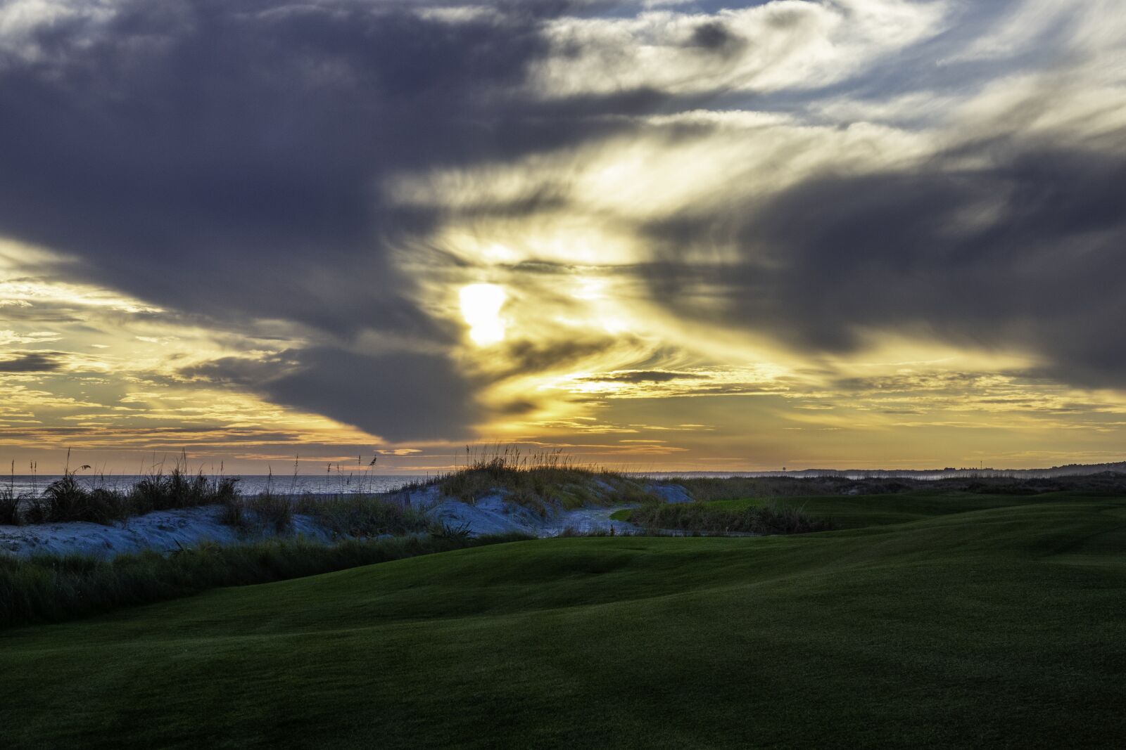 Sony Cyber-shot DSC-RX10 III sample photo. Golf course, shore, sky photography