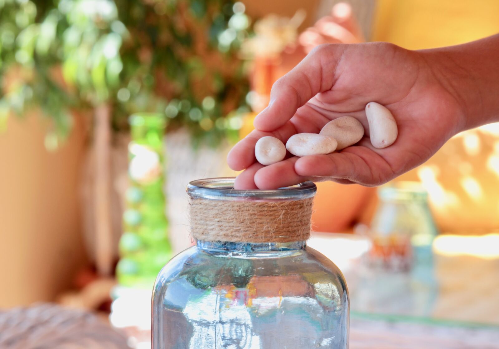 Canon EOS M sample photo. Hand, sassi, glass jars photography