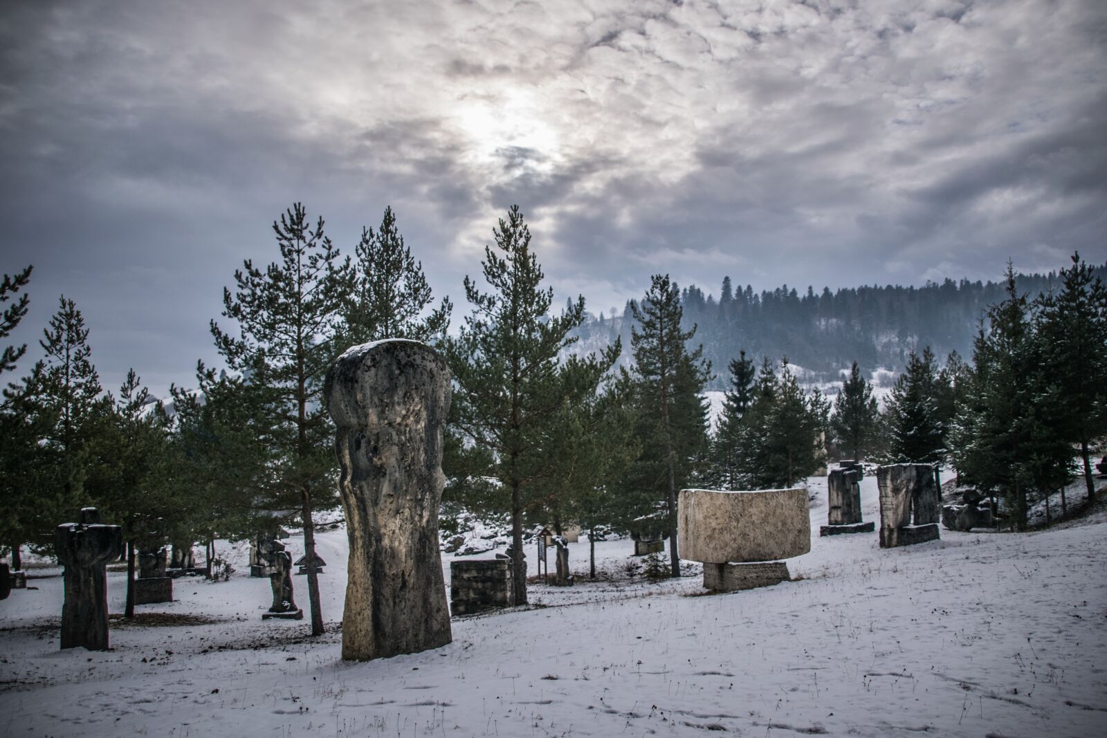 Nikon D5300 sample photo. Stone carvings, clouds, stone photography
