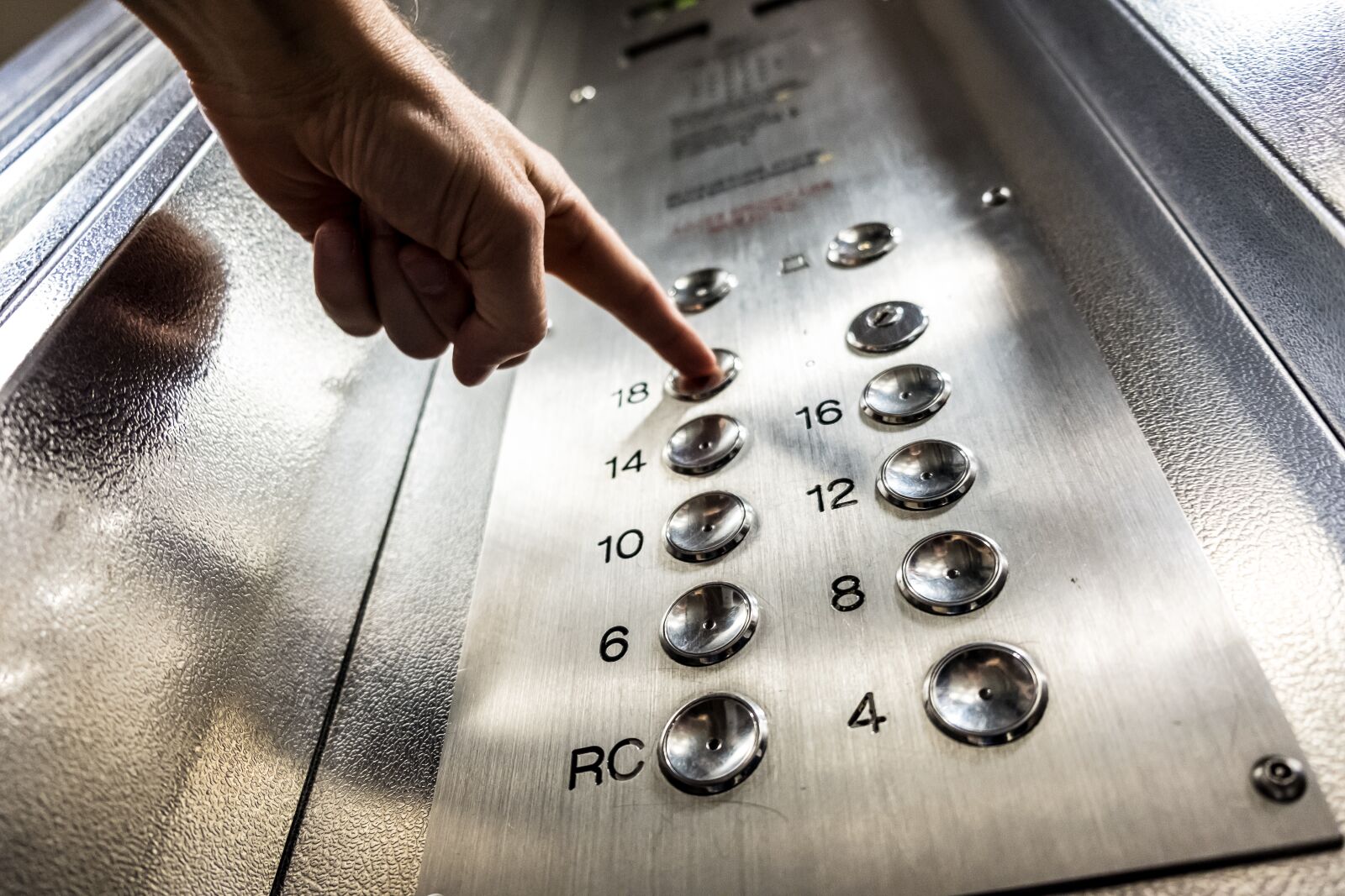 Fujifilm X-T2 sample photo. Elevator, button, finger photography