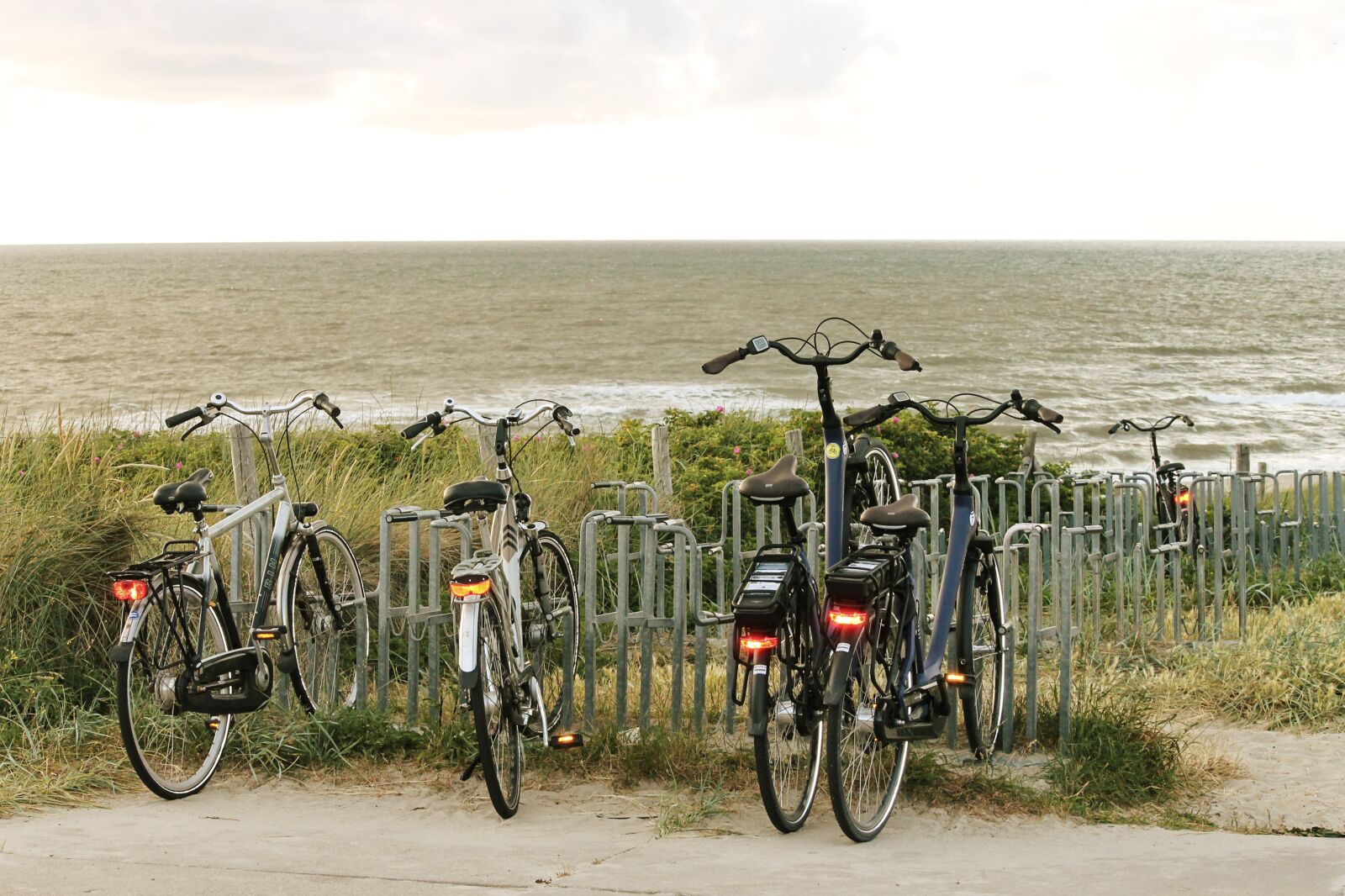 Canon EOS 1100D (EOS Rebel T3 / EOS Kiss X50) sample photo. Bicycles, sea, dunes photography