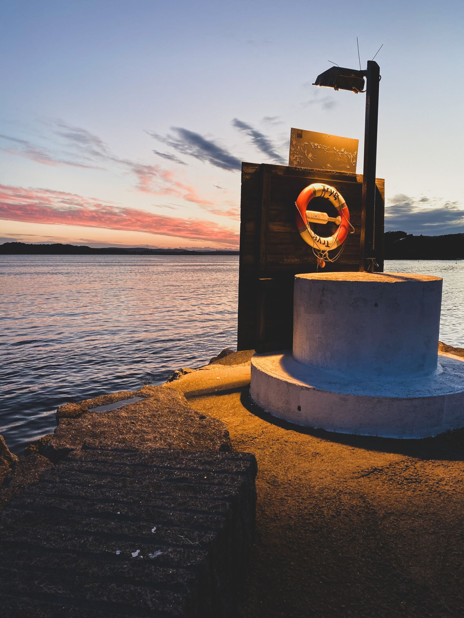 Apple iPhone 11 sample photo. Lifebuoy, water, lamp photography