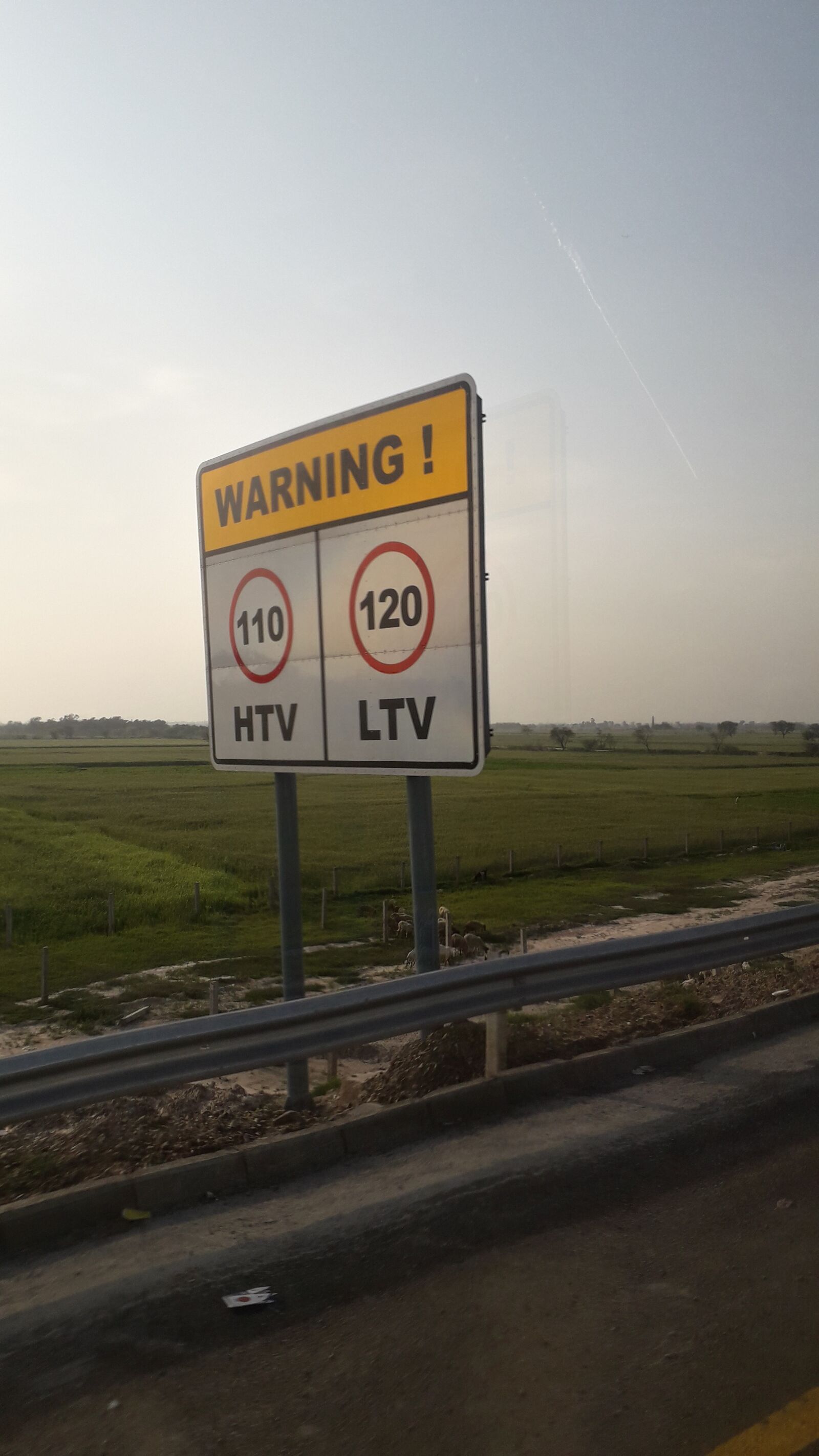 Samsung Galaxy J6 sample photo. Sunset, road, sign photography