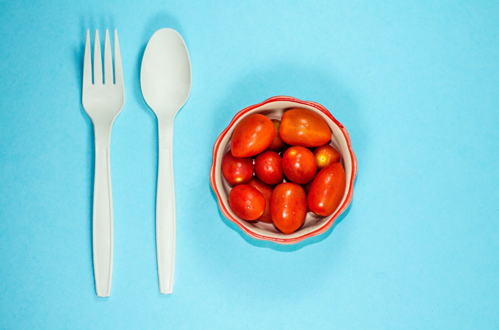 Nikon D7000 sample photo. Cherry tomatoes, blue background photography
