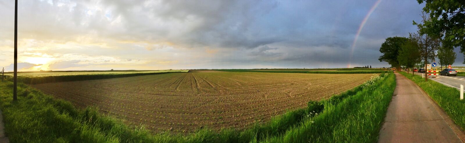 iPhone SE back camera 4.15mm f/2.2 sample photo. Rainbow, pano, evening photography