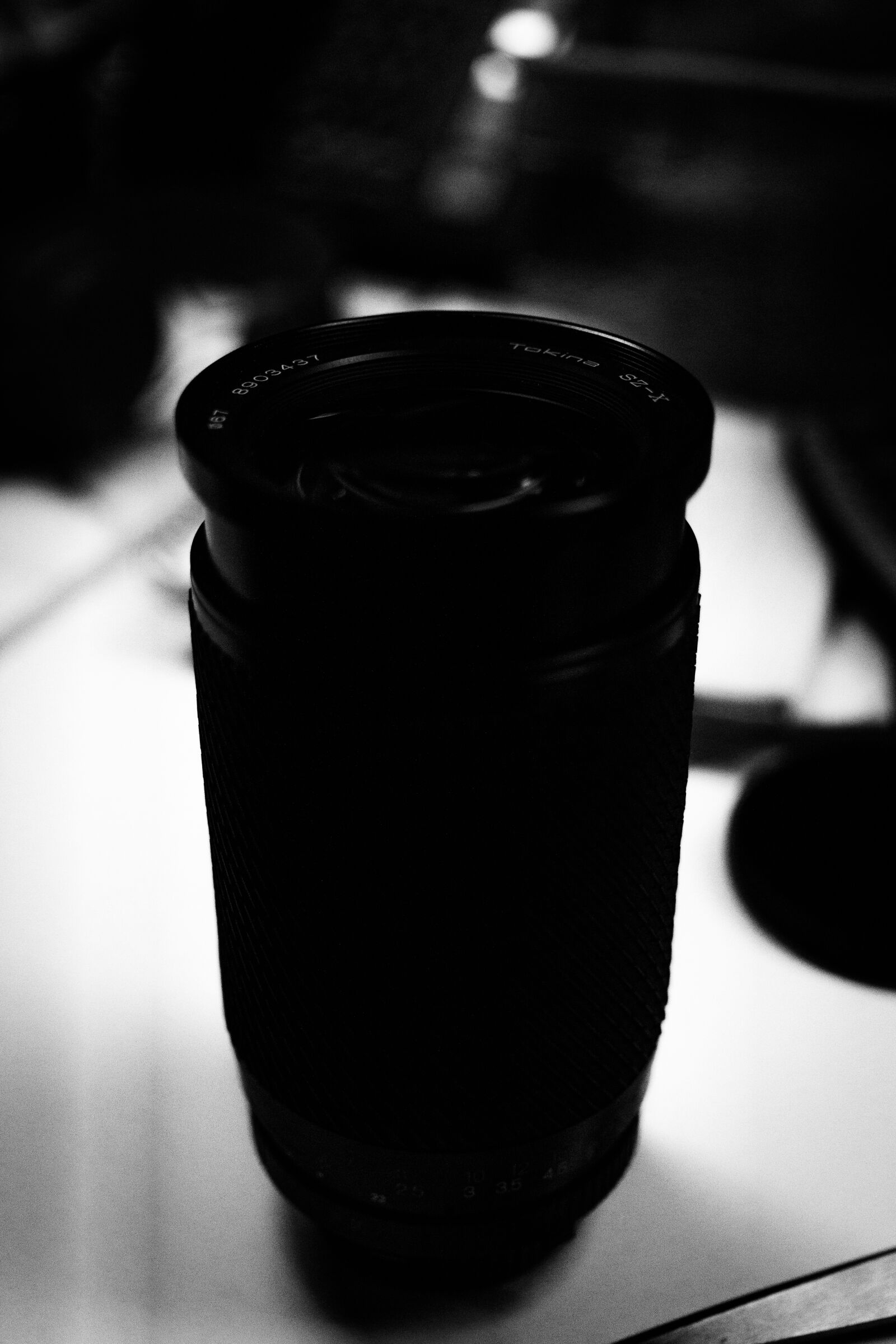 Sony a6000 + Sigma 30mm F2.8 EX DN sample photo. Bokeh, bw, desk, gear photography