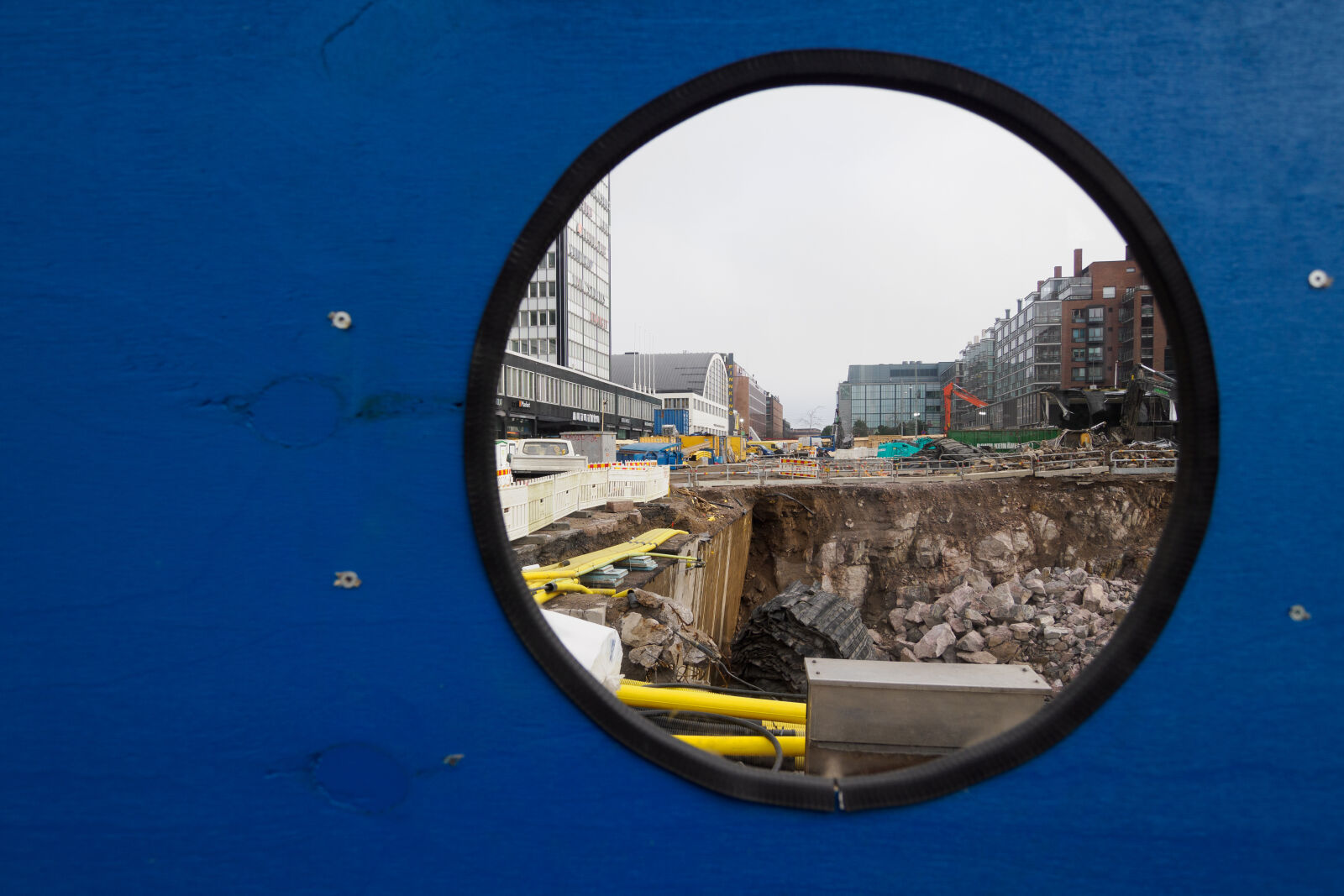 OM System 9-18mm F4.0-5.6 II sample photo. Construction yard window photography