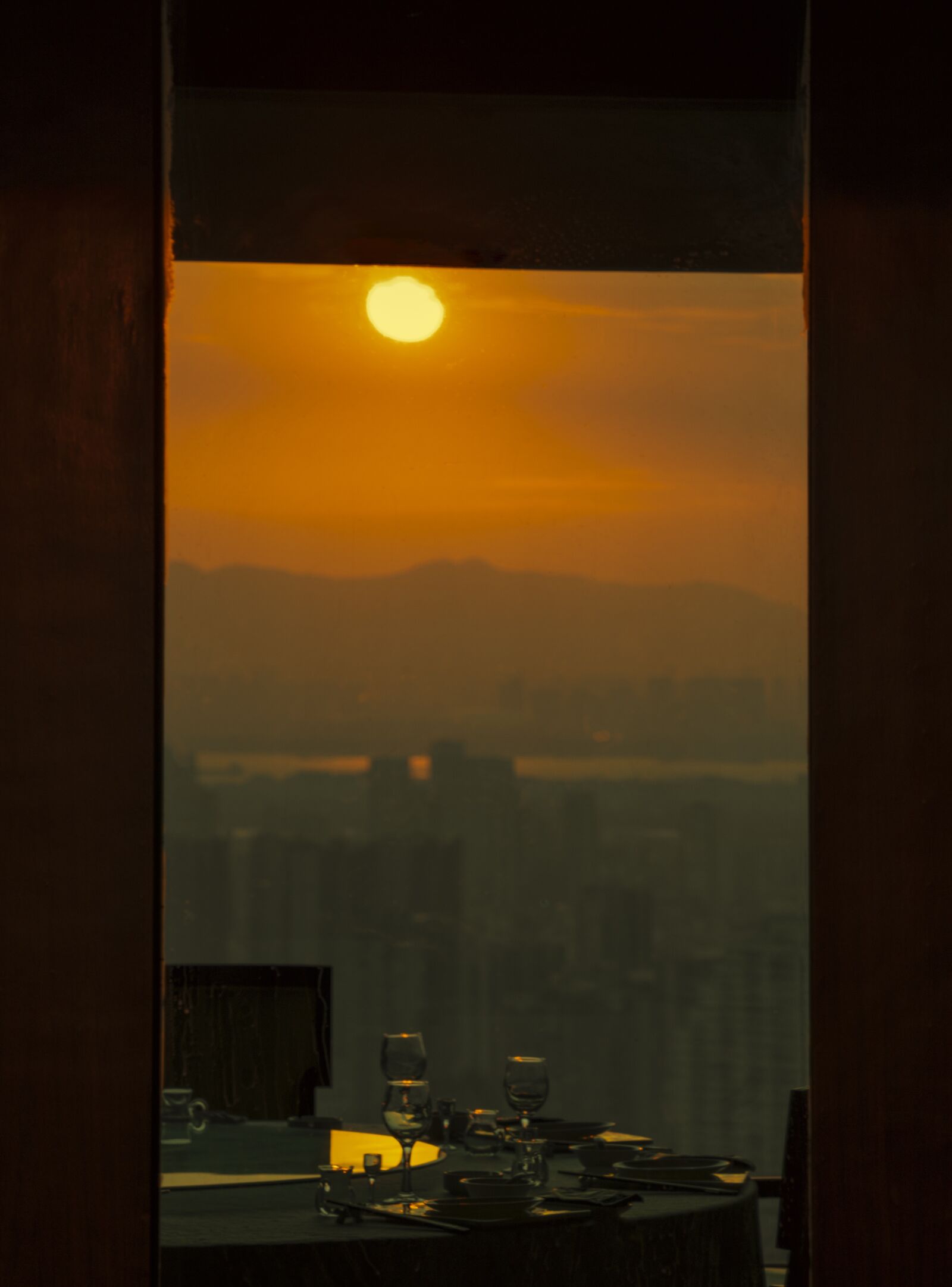 Sony a7R III + Tamron 28-200mm F2.8-5.6 Di III RXD sample photo. Sunset, buildings, table photography
