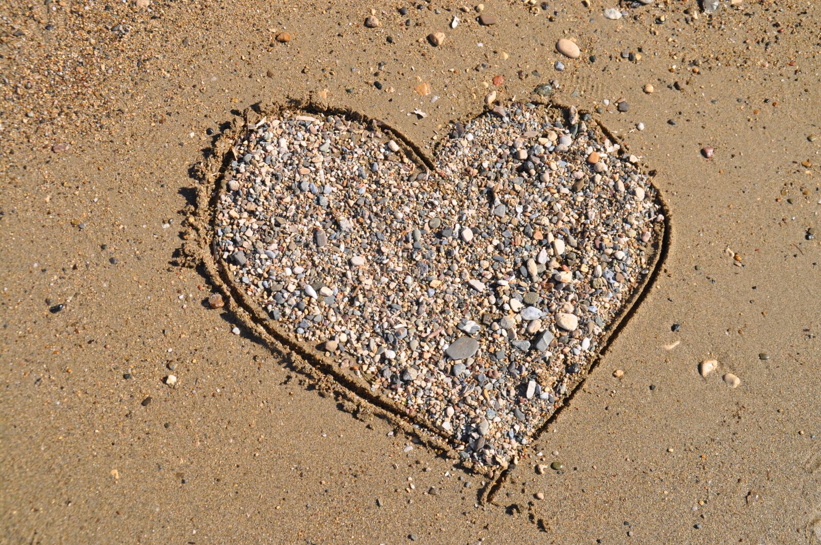 Nikon D5000 sample photo. Heart, sand, stone heart photography