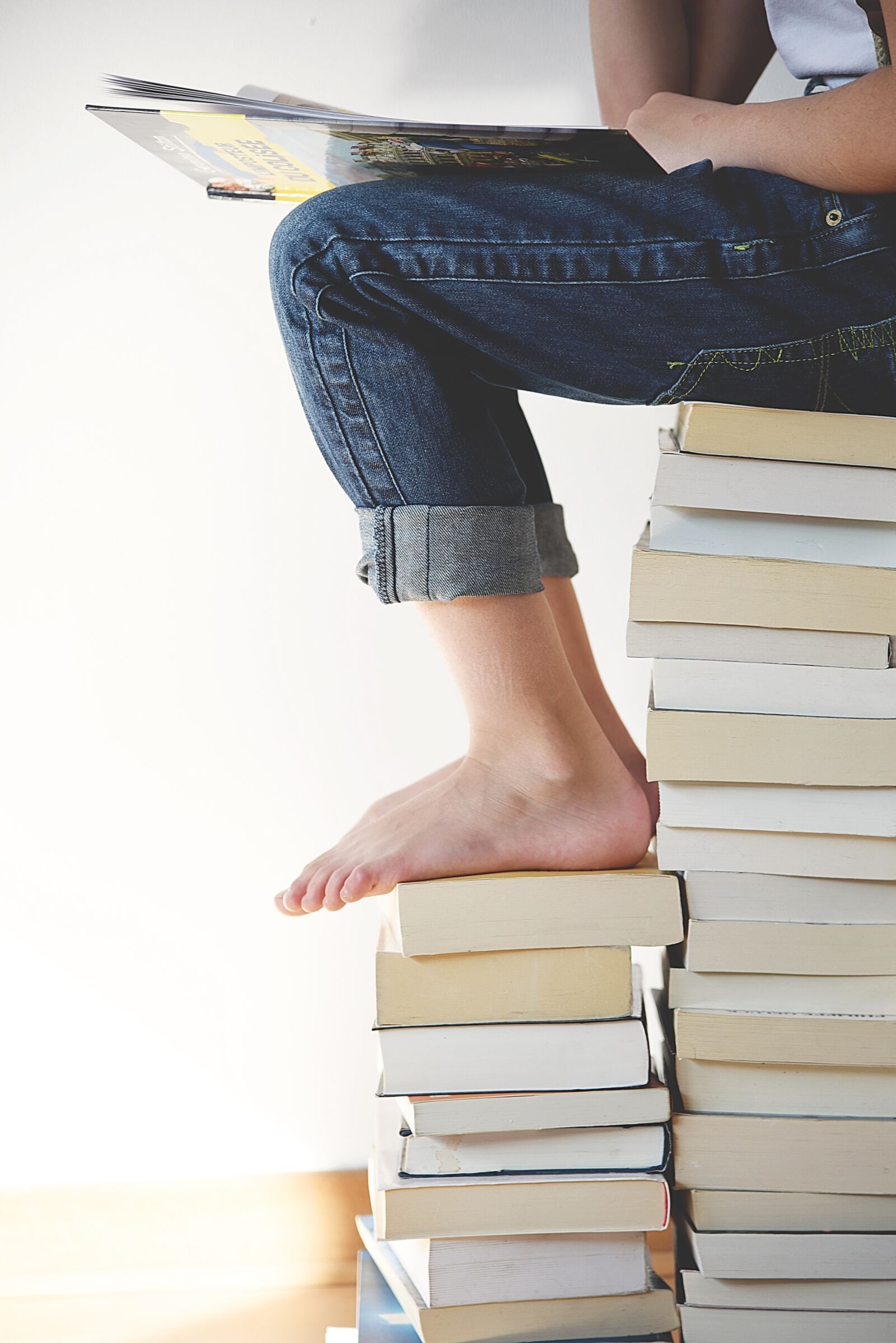 Nikon D750 sample photo. Books, feet, legs photography