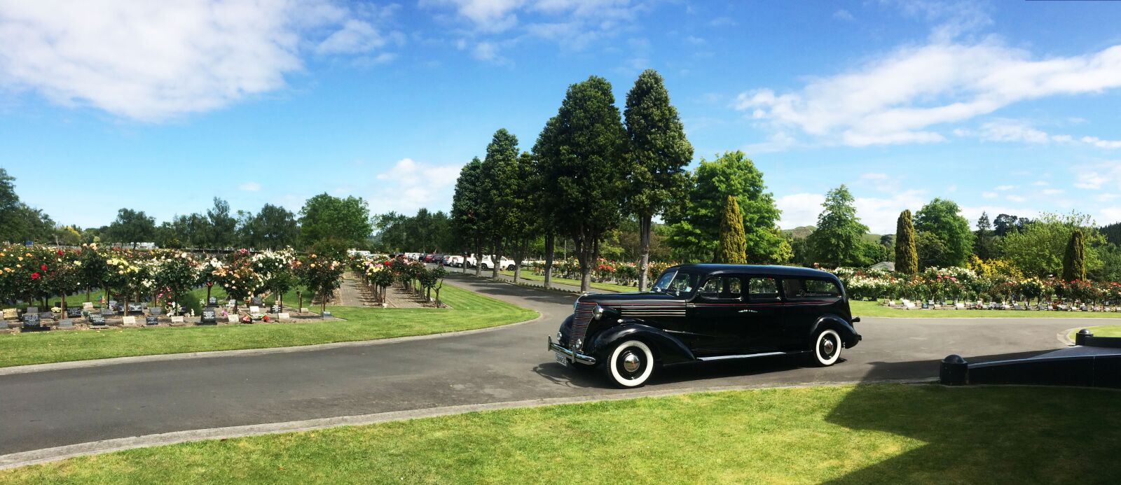 iPhone 5s back camera 4.15mm f/2.2 sample photo. Cemetery, vintage hearse, funeral photography
