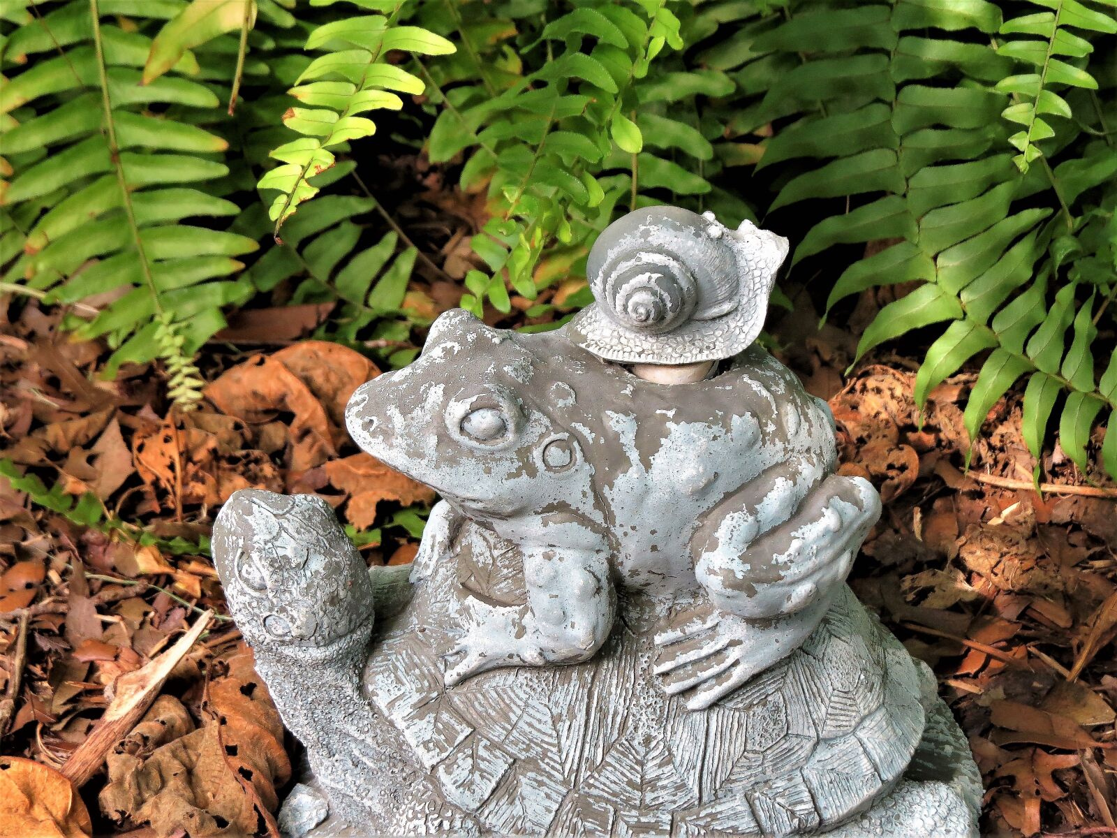 Canon PowerShot SX50 HS sample photo. Garden statue, power blue photography