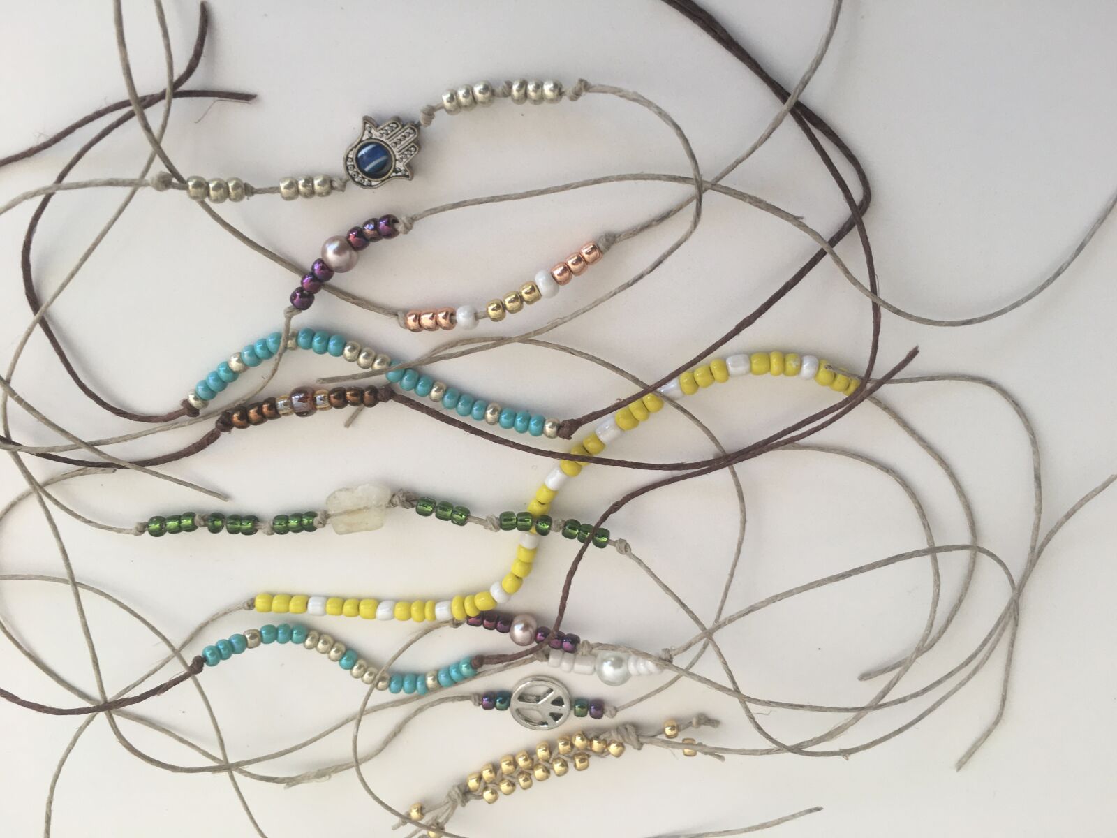 Apple iPhone 6s sample photo. Friendship bracelets, bracelets, jewelry photography