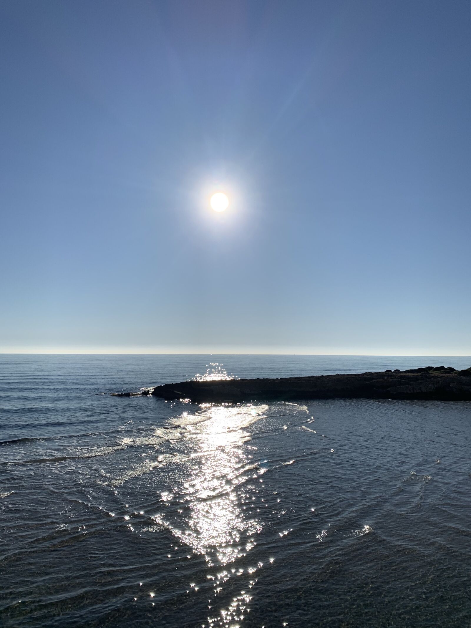 Apple iPhone XR sample photo. Sun, blue sky, ocean photography