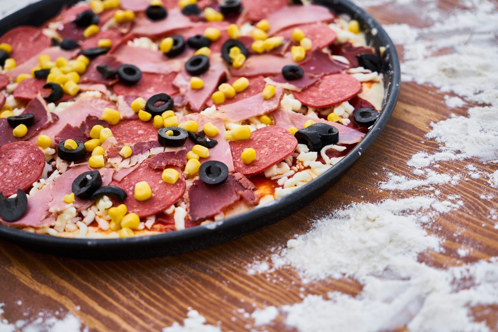 Sony a7R II sample photo. Flour, pizza, sausage photography