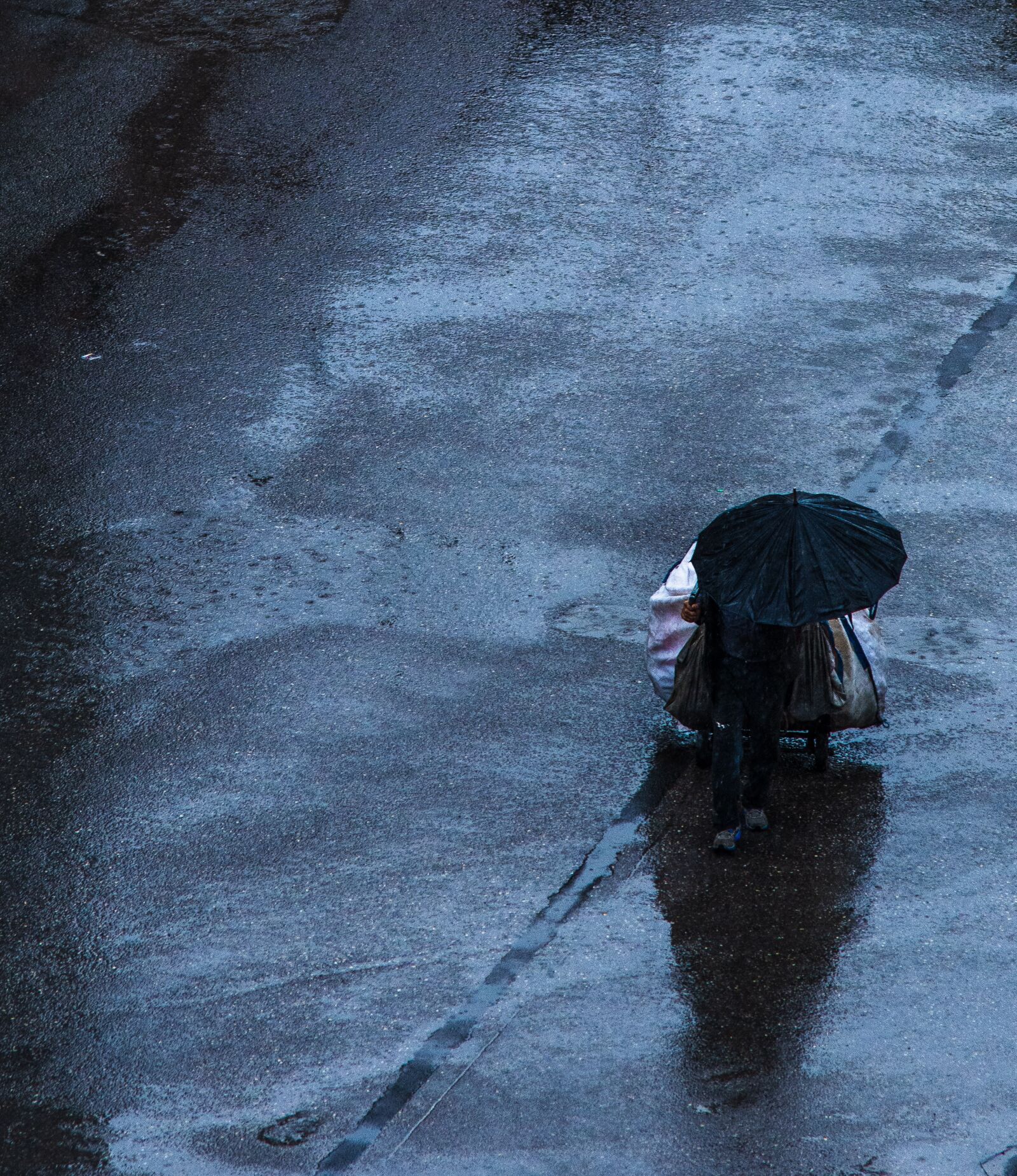 Nikon D5200 sample photo. Rain, man, street photography