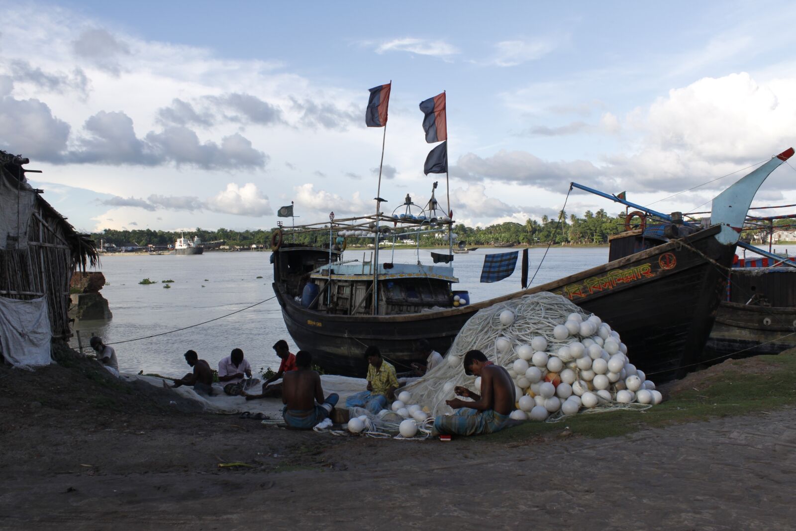 Canon EOS 500D (EOS Rebel T1i / EOS Kiss X3) sample photo. Bangladesh, canal, fisherman, flower photography