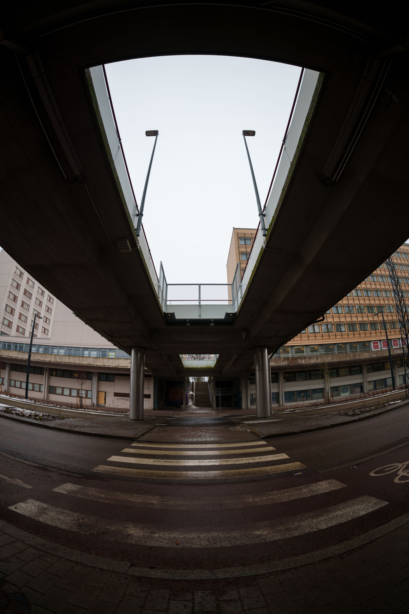 Sigma 15mm F1.4 DG DN Diagonal Fisheye Art sample photo. Bridge over street photography