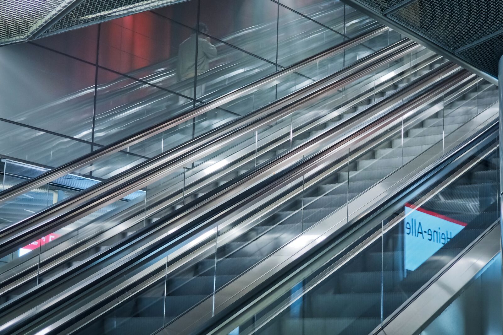 Olympus OM-D E-M10 sample photo. Escalator, underground, handrails photography