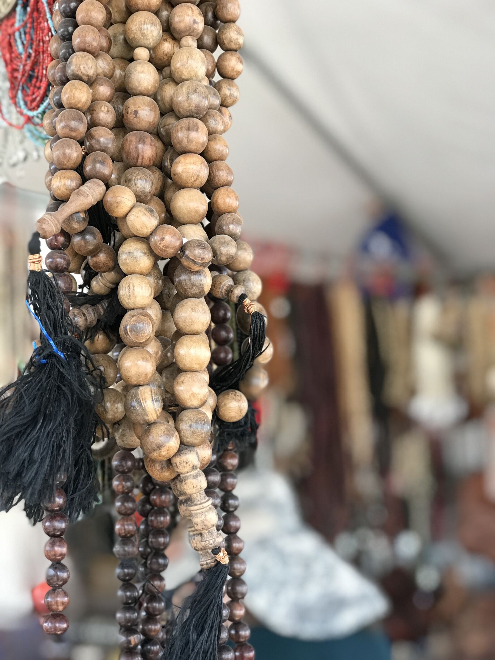 iPhone 7 Plus back dual camera 6.6mm f/2.8 sample photo. Wooden beads, tucson gem photography