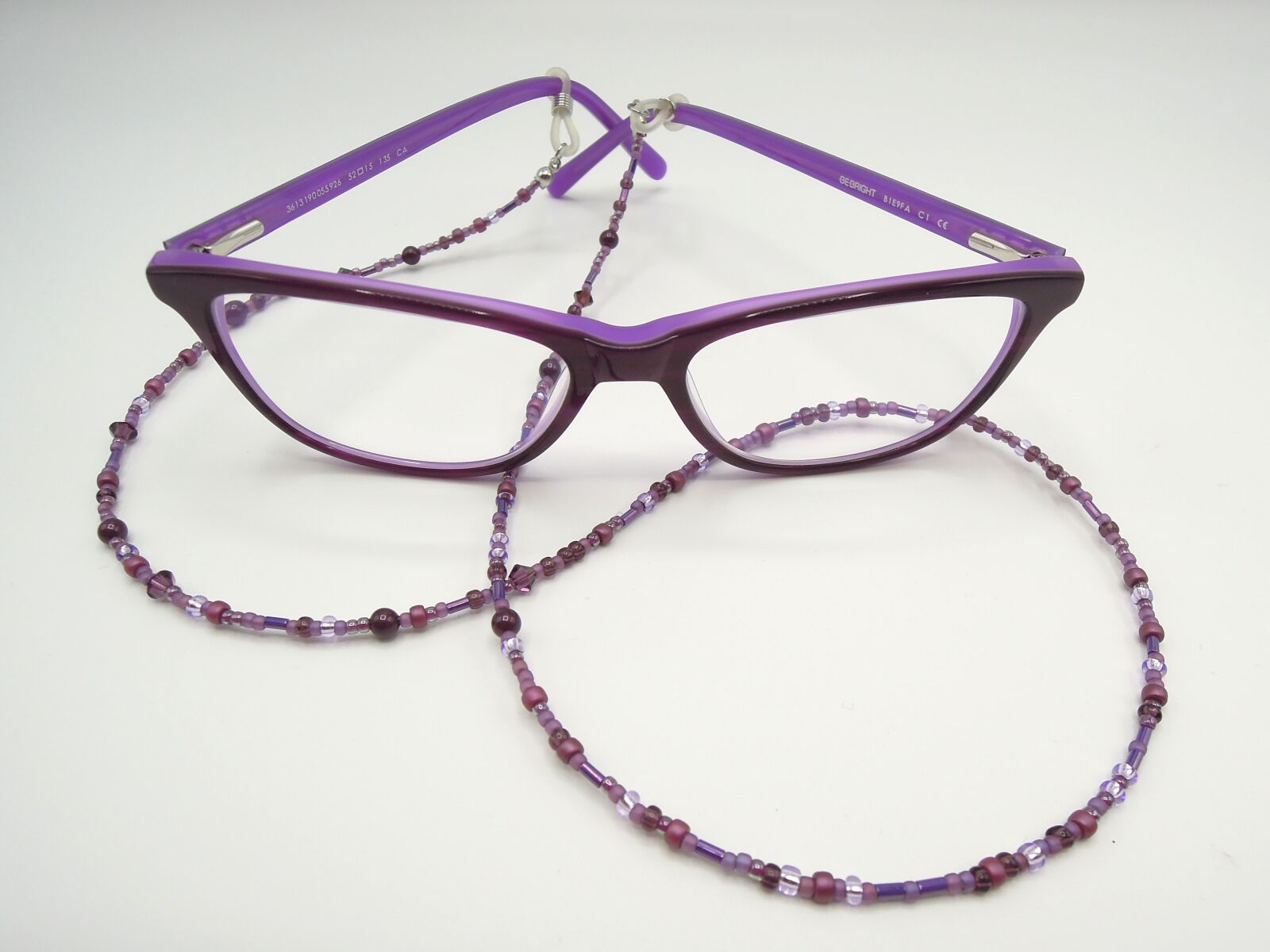 Nikon Coolpix P300 sample photo. Specs, glasses chain, purple photography