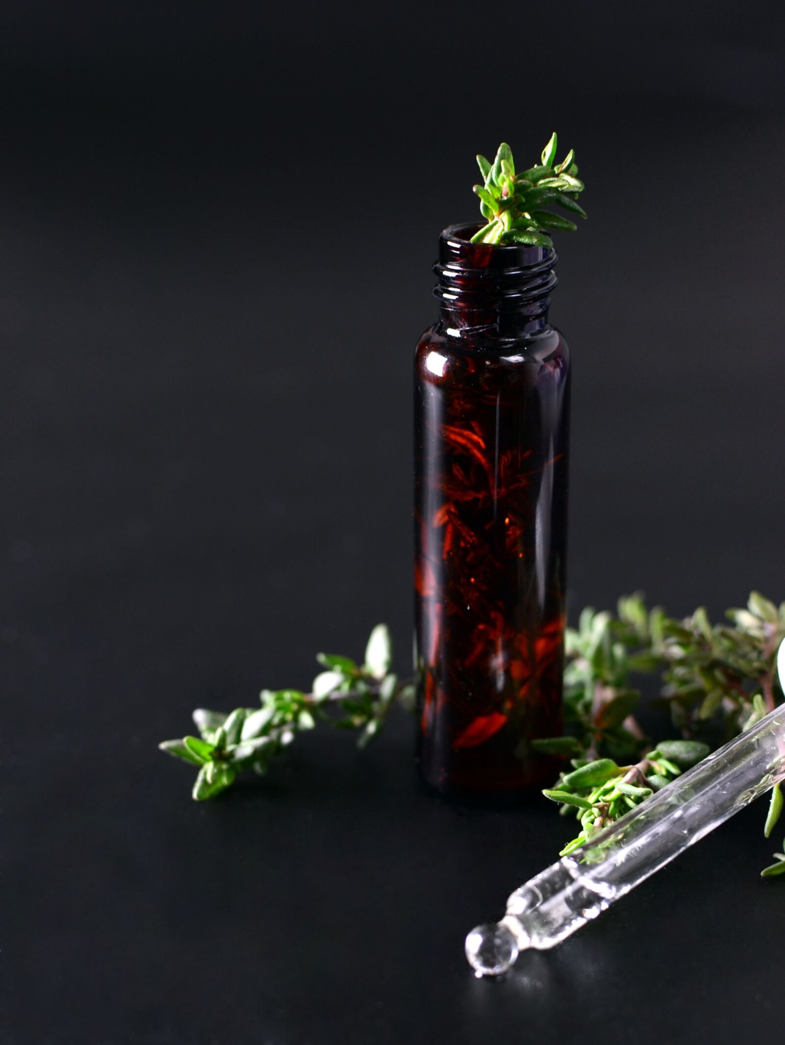 Nikon D3100 sample photo. Essential oils, thyme, alternative photography