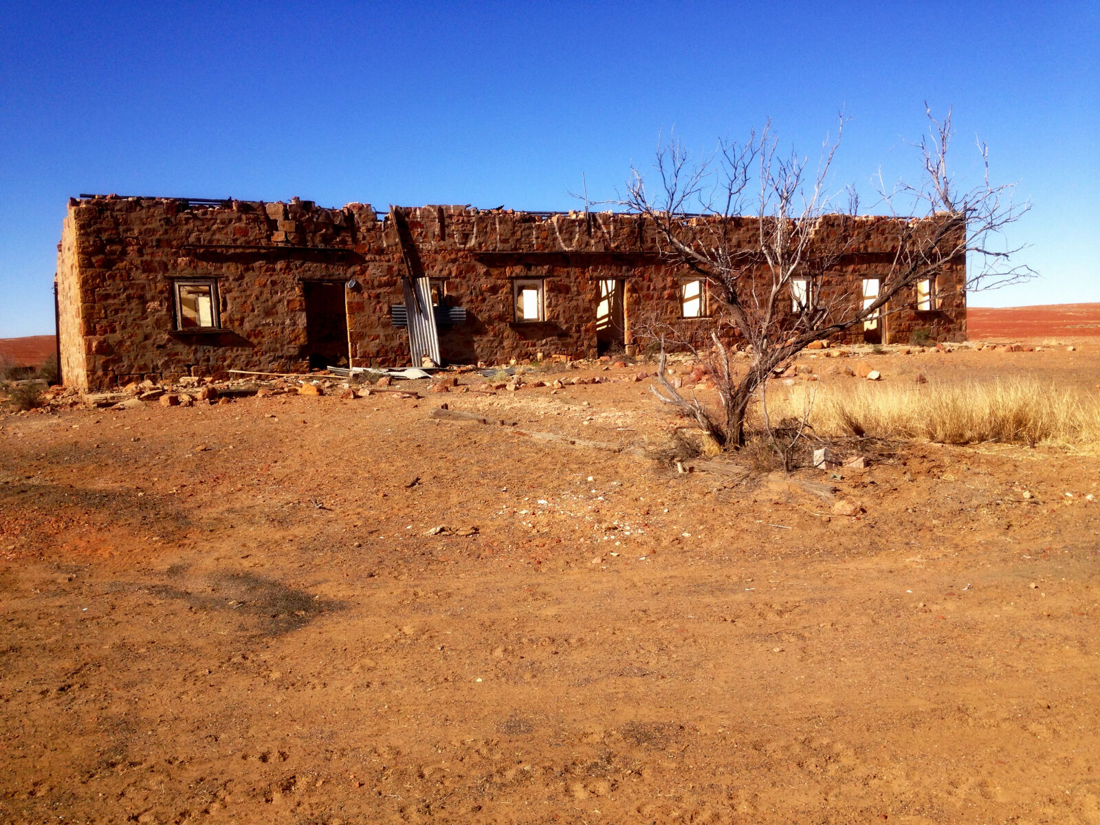 iPhone 5c back camera 4.12mm f/2.4 sample photo. Abandoned, blue, sky, building photography