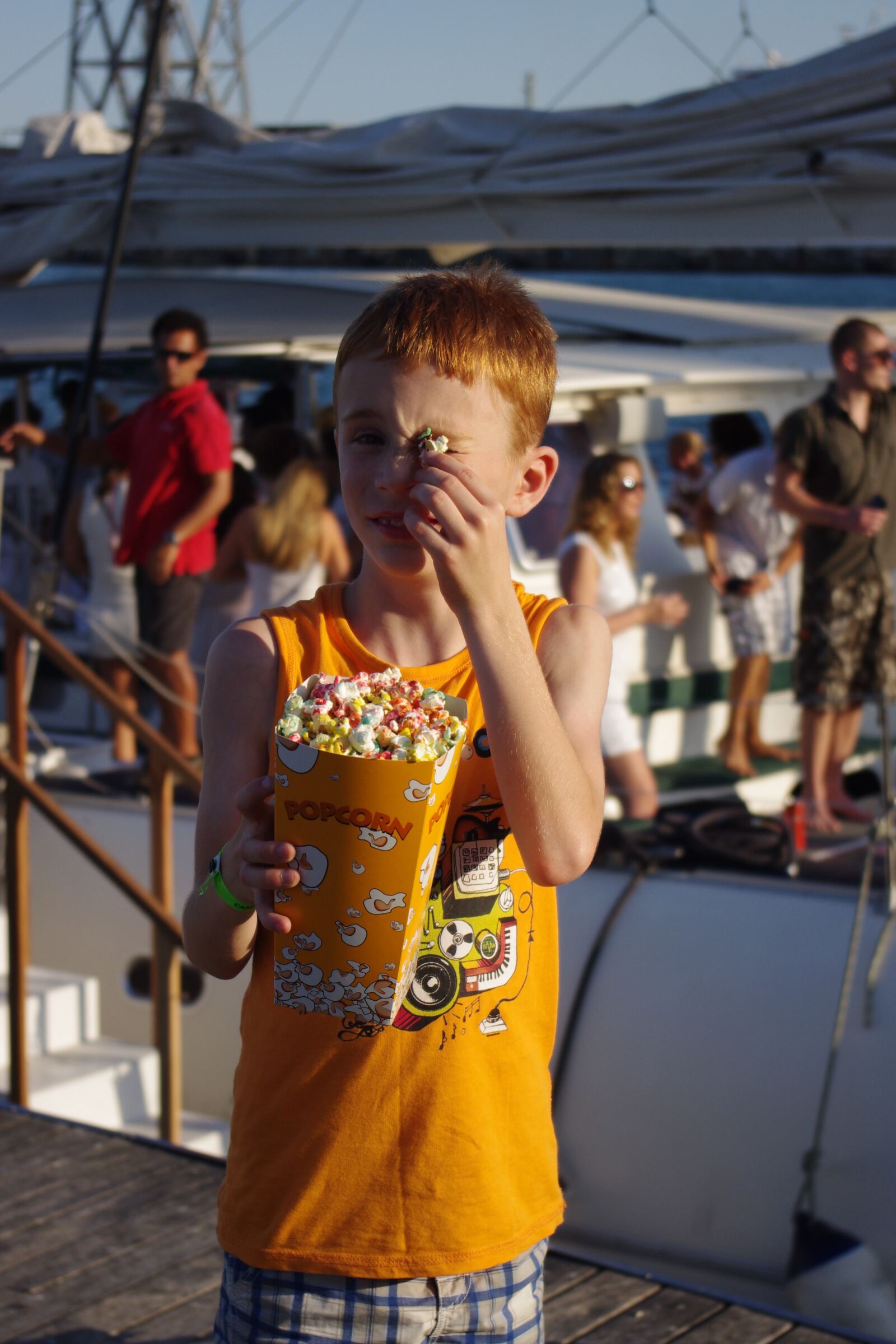 Pentax K-x sample photo. Boy, popcorn, summer photography