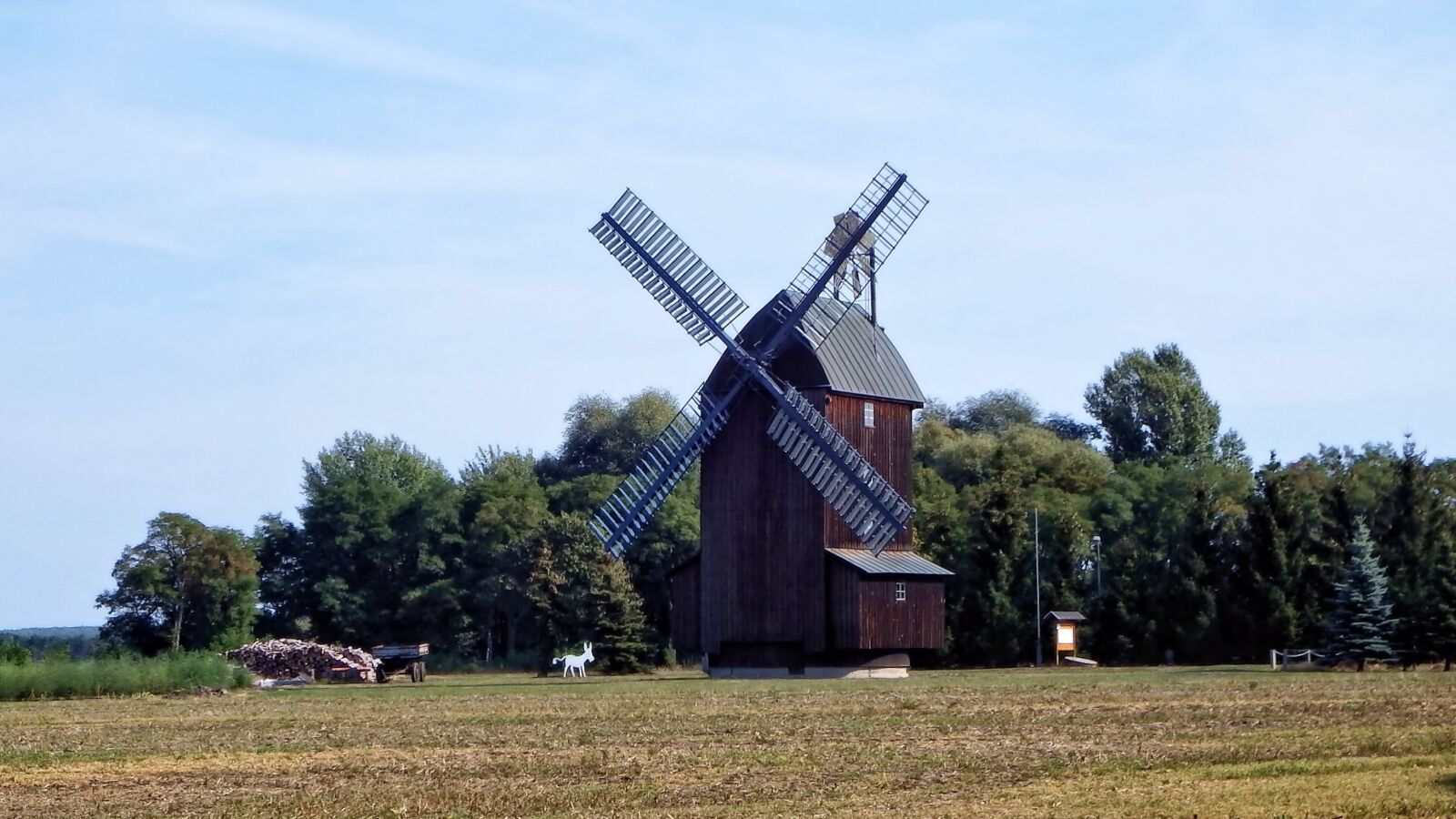 Fujifilm FinePix SL1000 sample photo. Windmill, mill, trees photography