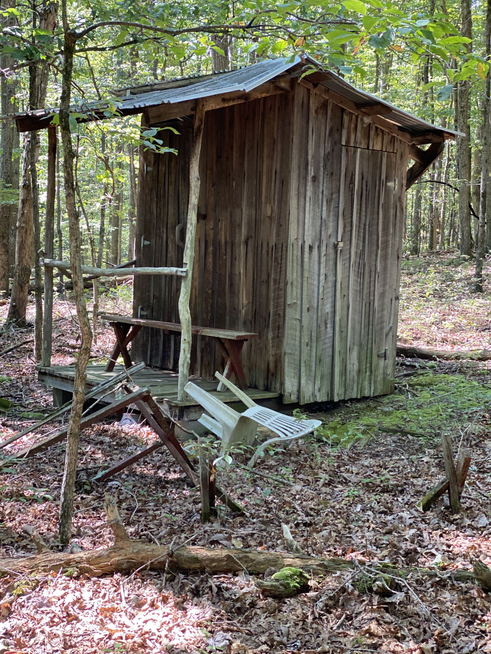 iPhone 11 Pro back dual camera 6mm f/2 sample photo. Wood building, outhouse, toilet photography