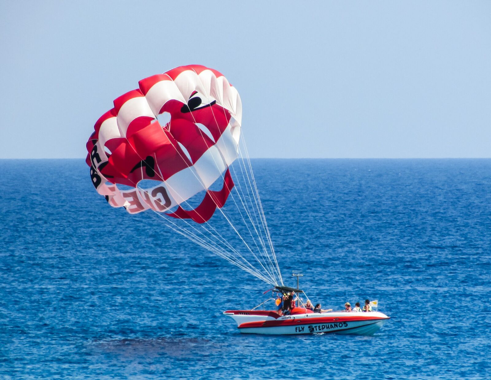 Canon PowerShot SX400 IS sample photo. Parachute, paragliding, red photography