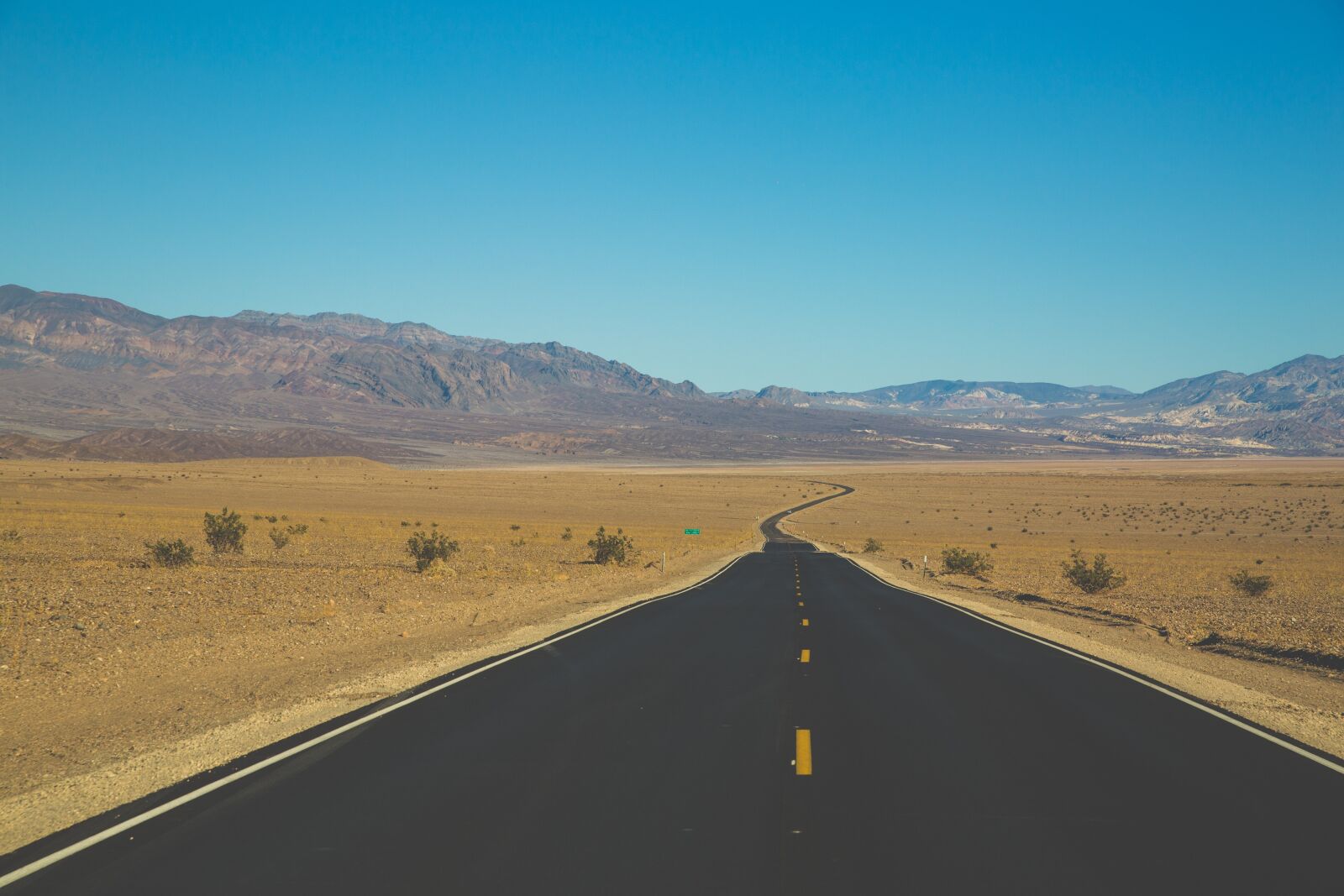 Canon EF 24-70mm F2.8L II USM sample photo. Barren, desert, highway photography