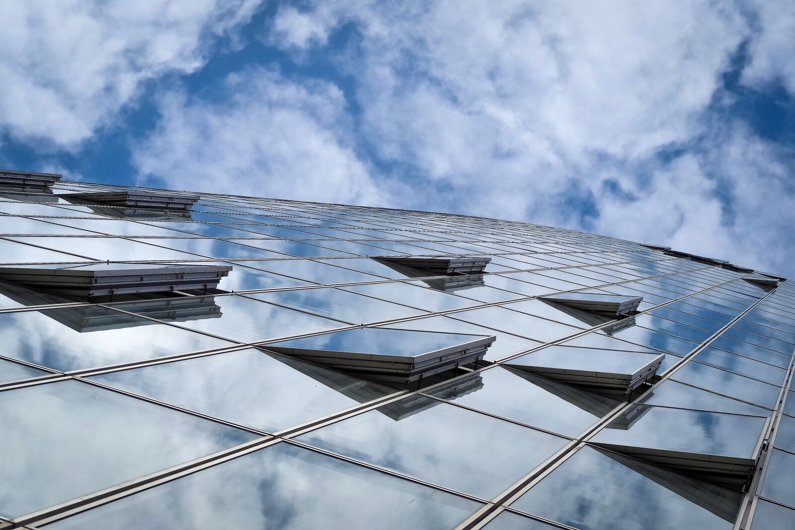 Olympus OM-D E-M10 sample photo. Architecture, skyscraper, glass facades photography