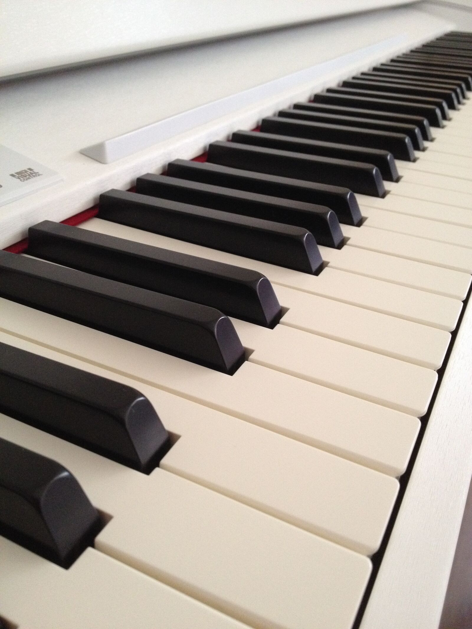 iPhone 4S back camera 4.28mm f/2.4 sample photo. Piano, keyboard, white photography