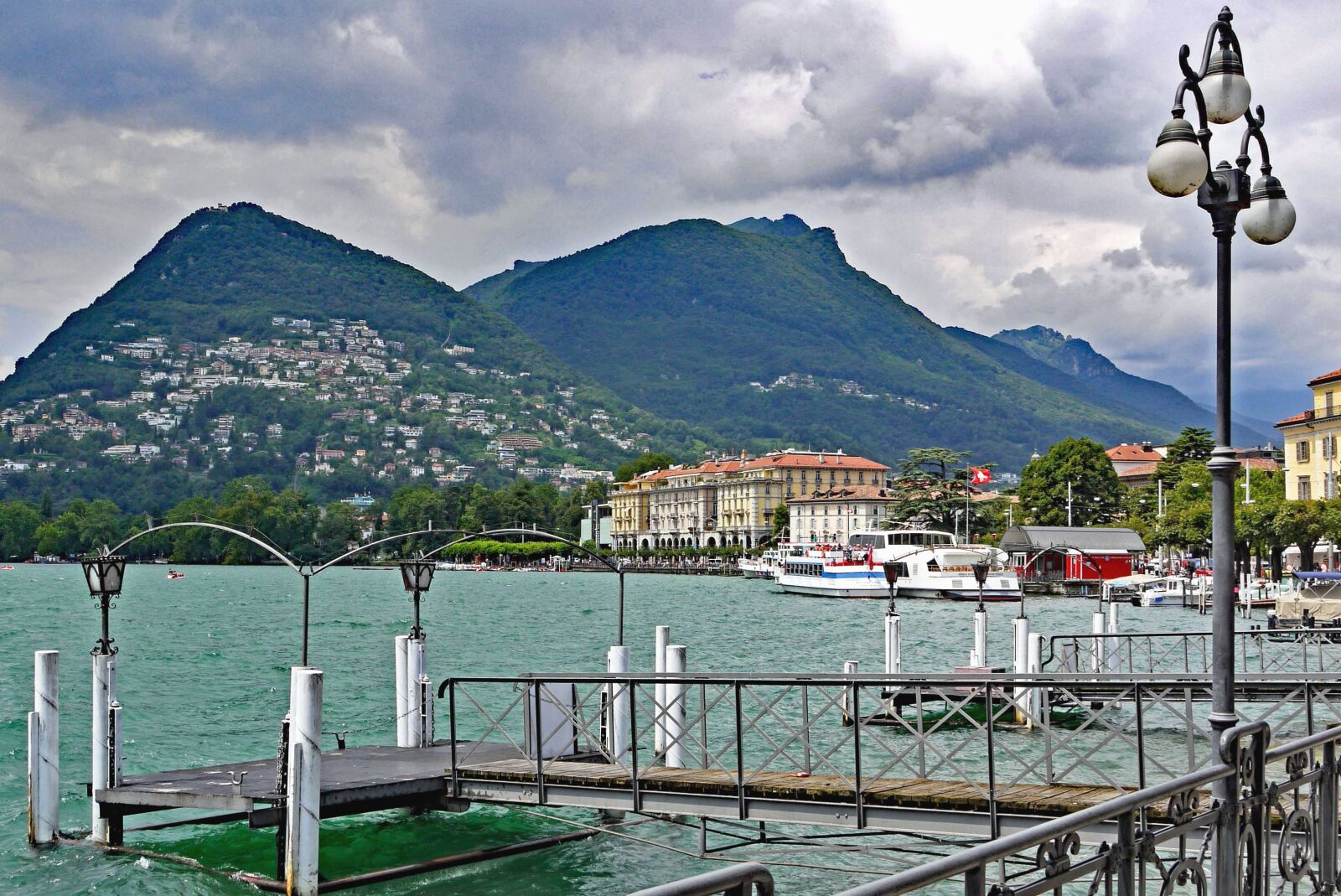 Panasonic Lumix DMC-G1 sample photo. Water, mountain, boat, building photography