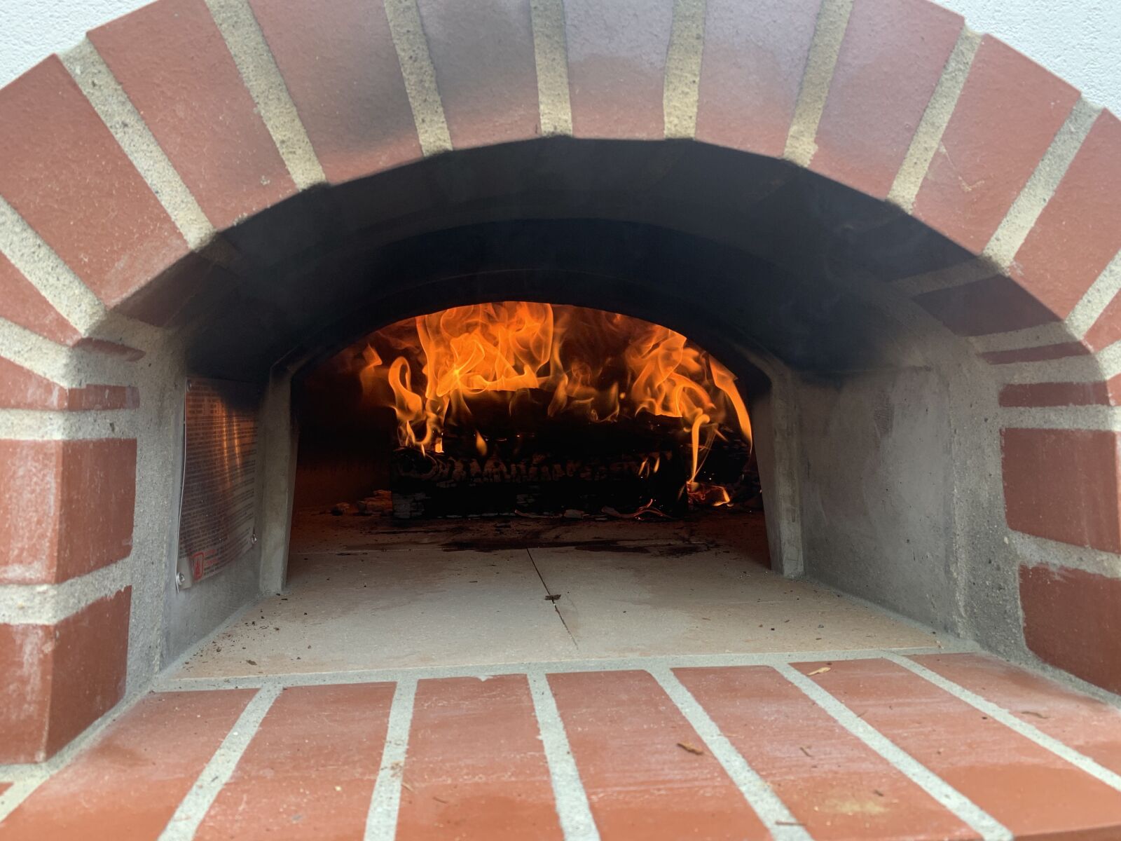 Apple iPhone XS Max + iPhone XS Max back dual camera 4.25mm f/1.8 sample photo. Pizza oven, fire, oven photography